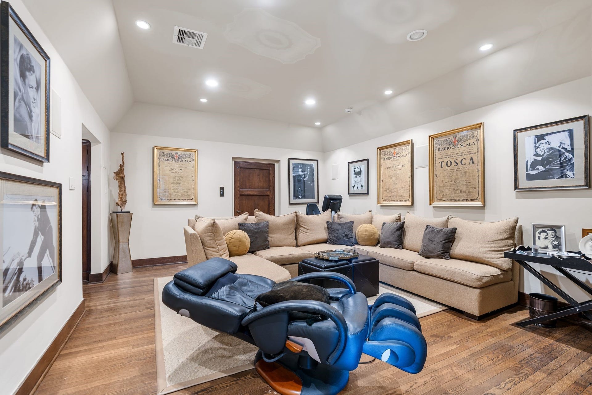 [Media Room]
The media room has an elevator stop, and a media cabinet with large-screen television shelf, mesh-front cabinets, and vertical pull-out shelves.