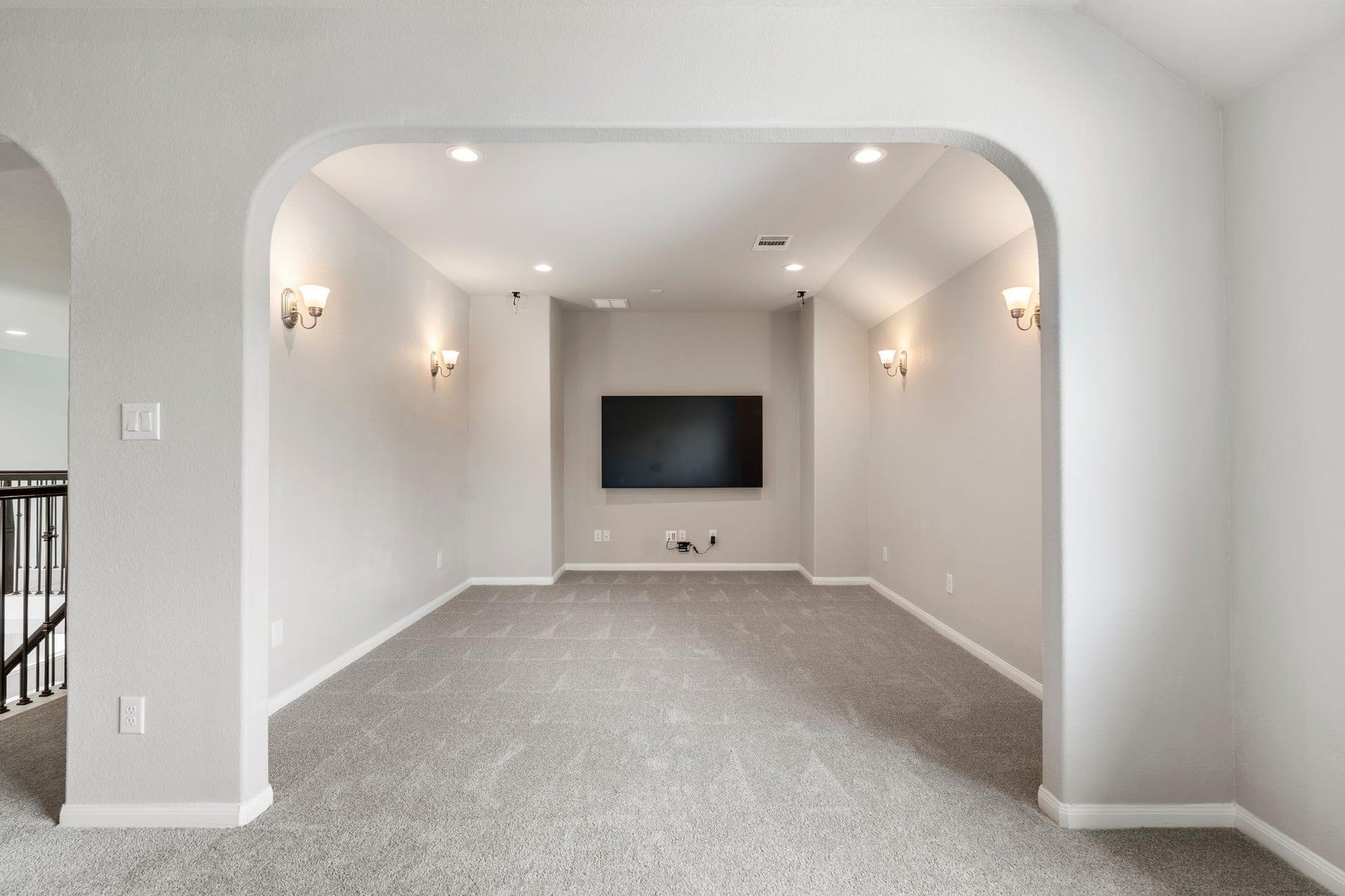 314 Arbor Ranch Circle, Richmond, TX 77469 Arched entry into the media space wired for surround speakers