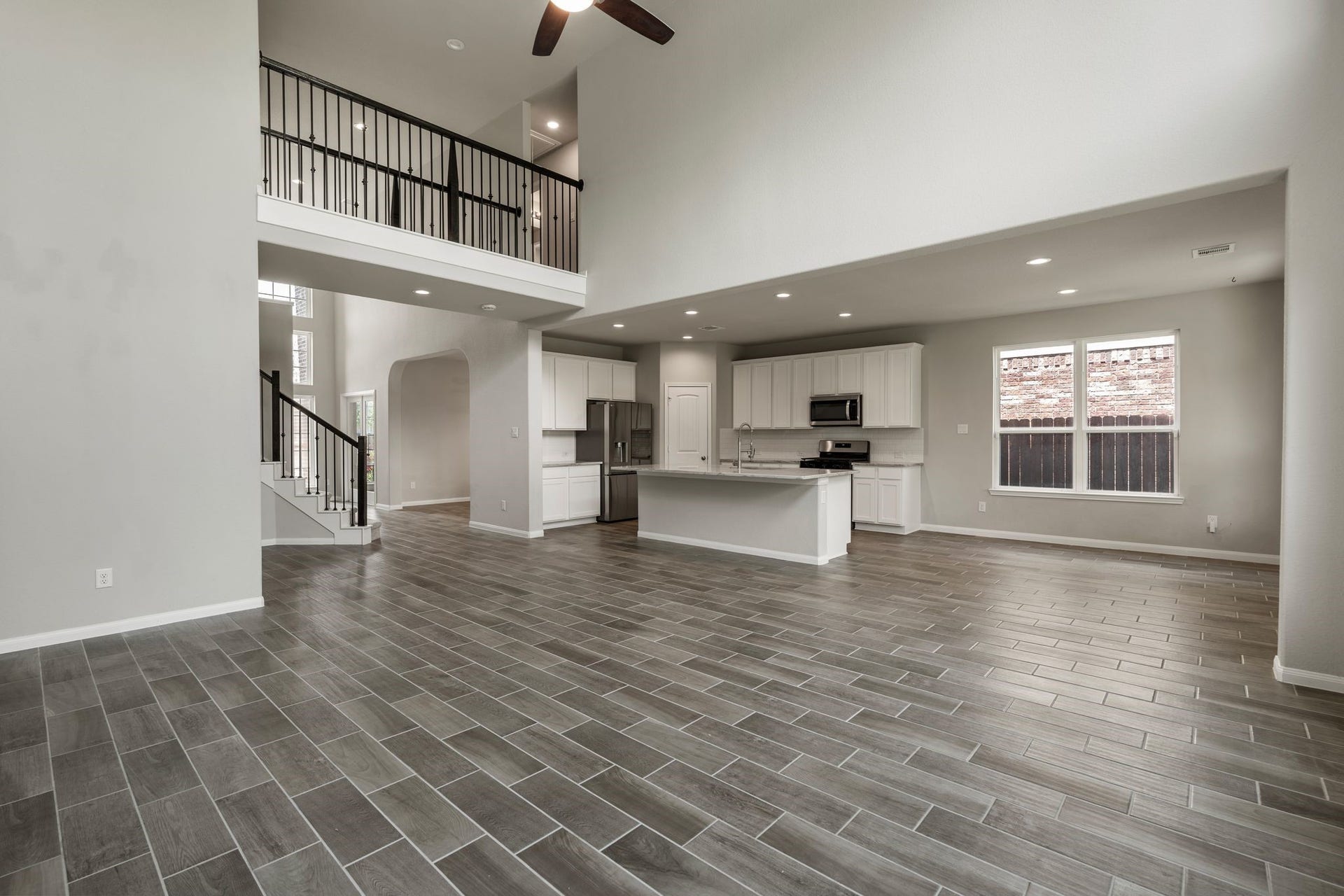 314 Arbor Ranch Circle, Richmond, TX 77469 Open-concept living area with rich wood-look flooring throughout