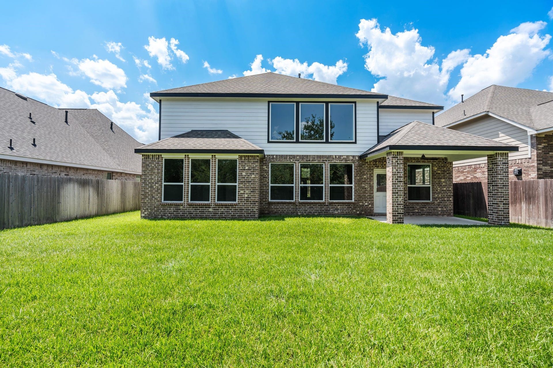 314 Arbor Ranch Circle, Richmond, TX 77469 Beautiful two-story exterior overlooking a lush backyard