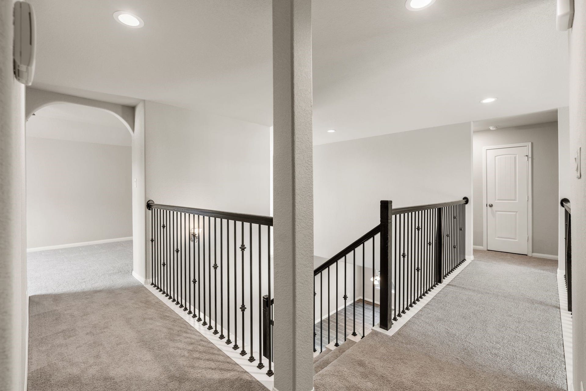 314 Arbor Ranch Circle, Richmond, TX 77469 Iron-spindle staircase leads to the second floor