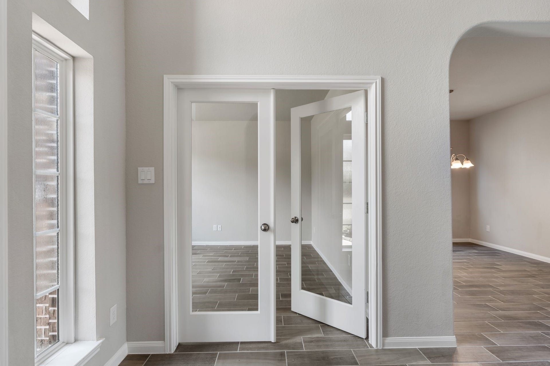 314 Arbor Ranch Circle, Richmond, TX 77469 French doors open to a versatile flex space perfect home office