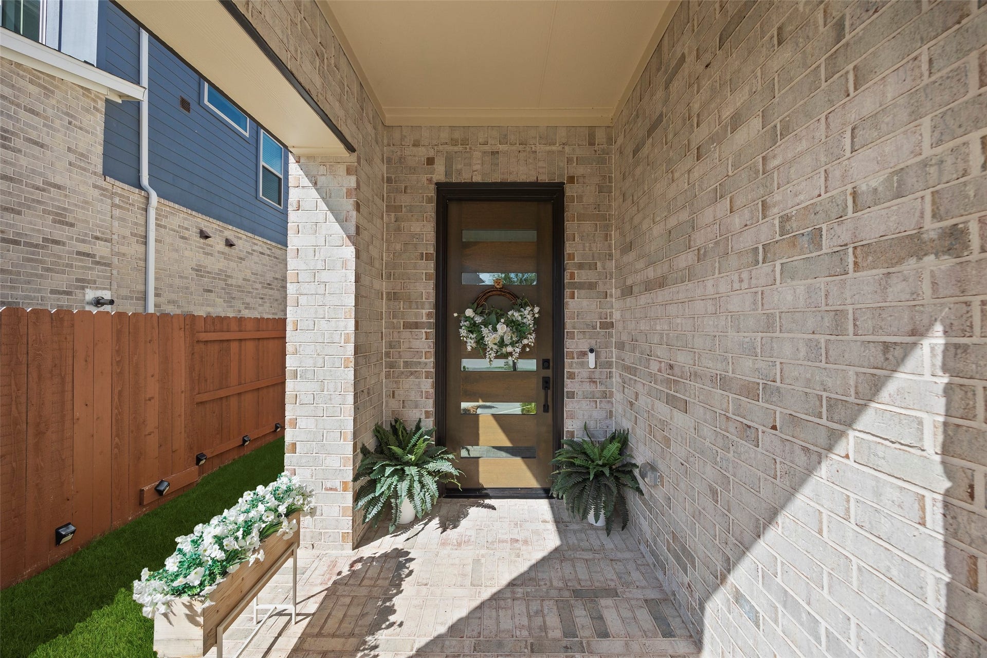 7311 Winding Aster Way, Katy, TX 77493 The recessed entry provides a protected arrival space, with room for planters and seasonal accents to personalize the entrance.