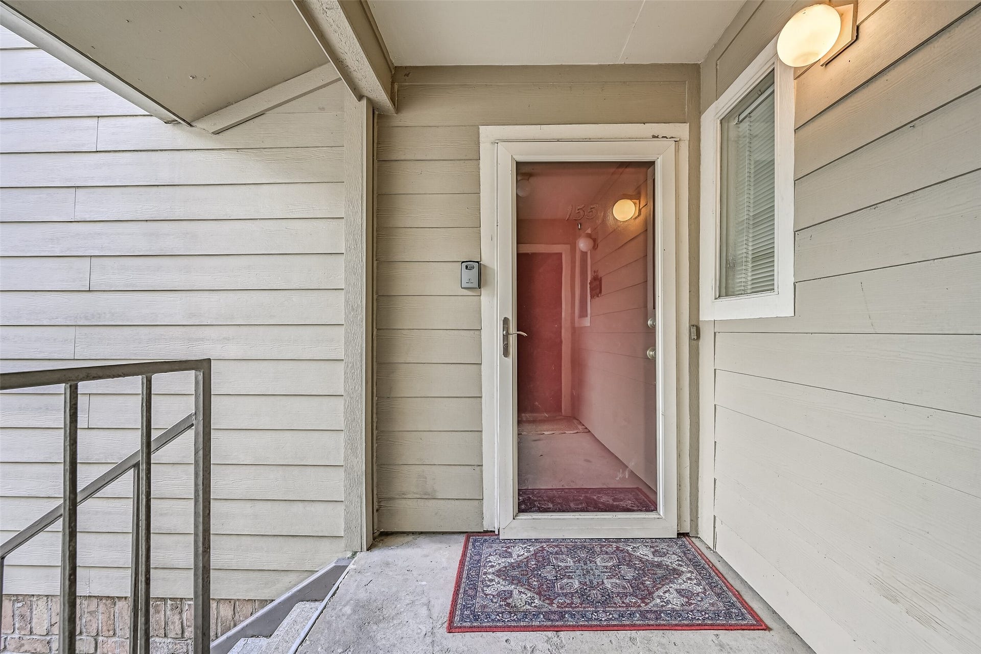 5005 Georgi Lane, #155, Houston, TX 77092 A covered second-floor entry welcomes you to Unit #155, with a storm door, exterior lighting & sheltered landing. Step inside to discover a spacious floor plan with wood-look flooring, neutral finishes & plenty of room to make yourself at home in this 2-bedroom condo.
