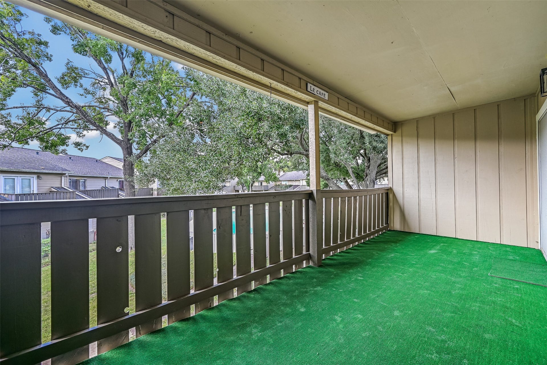 5005 Georgi Lane, #155, Houston, TX 77092 Enjoy views of the mature shade trees, landscaped courtyard & glimpses of the community pool from this spacious second-floor balcony! With plenty of room for patio furniture, this covered outdoor space provides a wonderful extension of the condo's living area & a great spot to unwind.