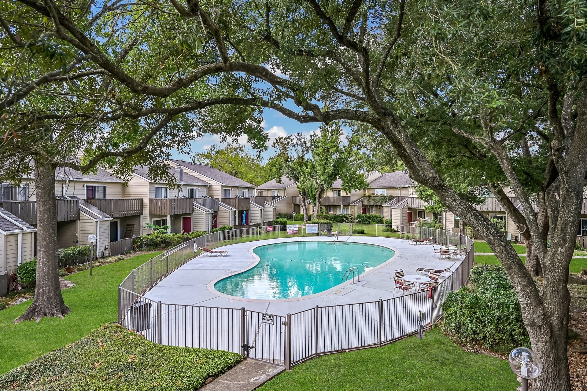 5005 Georgi Lane, #155, Houston, TX 77092 One of two swimming pools available to residents of Covered Bridge Condominiums! Surrounded by mature trees, landscaped grounds & neighboring residences, this community pool features a spacious deck with lounge chairs & seating areas. Enjoy a refreshing swim just steps from your condo!