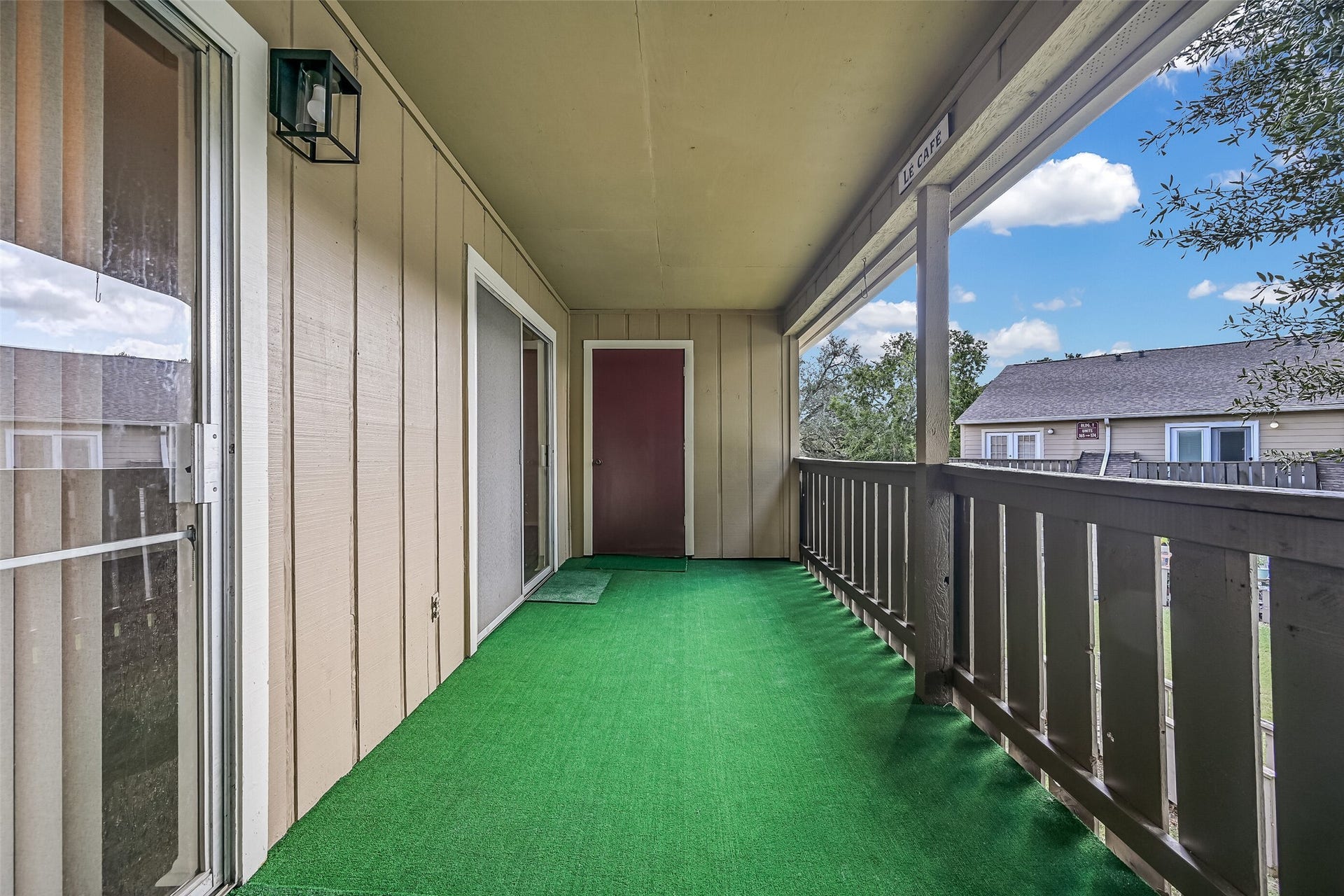 5005 Georgi Lane, #155, Houston, TX 77092 Step outside to an oversized covered balcony offering plenty of space for outdoor seating & relaxation! Accessible from the living & dining areas, this extended outdoor space features a protective roof overhead, open railings & an exterior storage closet at the far end for added functionality.