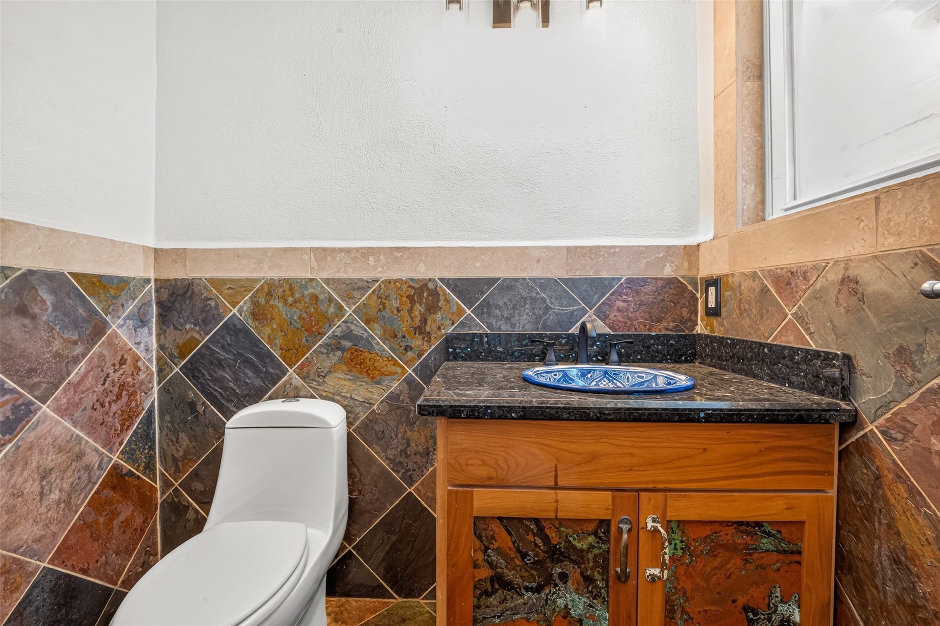 Toilet and sink area, Mirror will be installed over the vanity area.