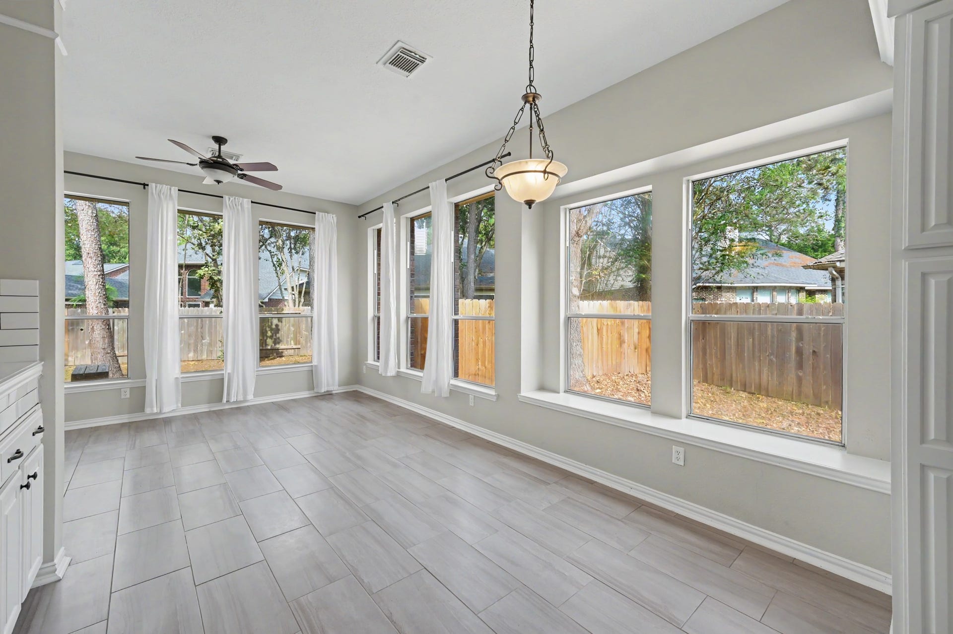 18207 Red Eagle Court, Humble, TX 77346 Another view of the breakfast room with the stunning walls of windows!