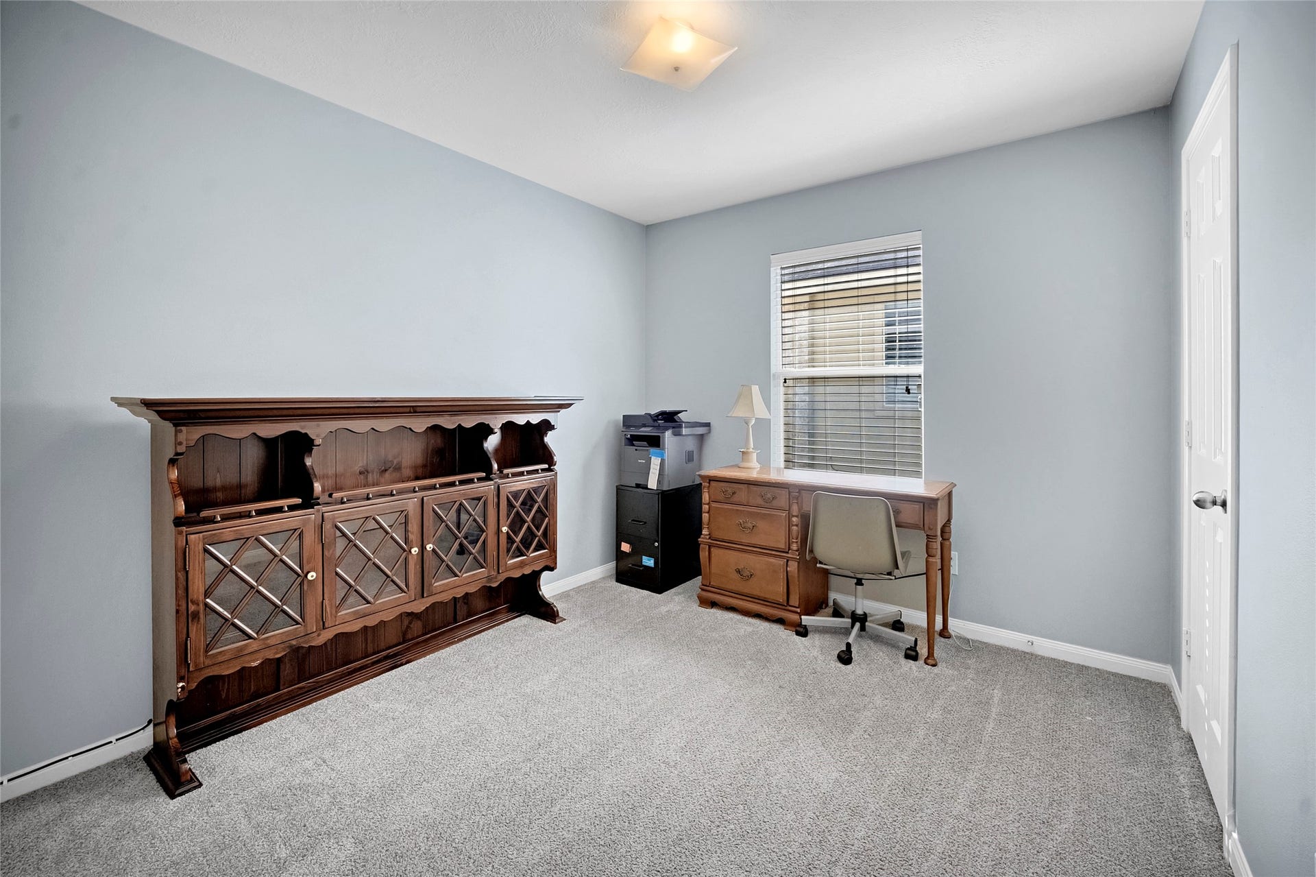 15835 Aldridge Creek Court, Cypress, TX 77429 Versatile furnished room currently arranged as a home office.