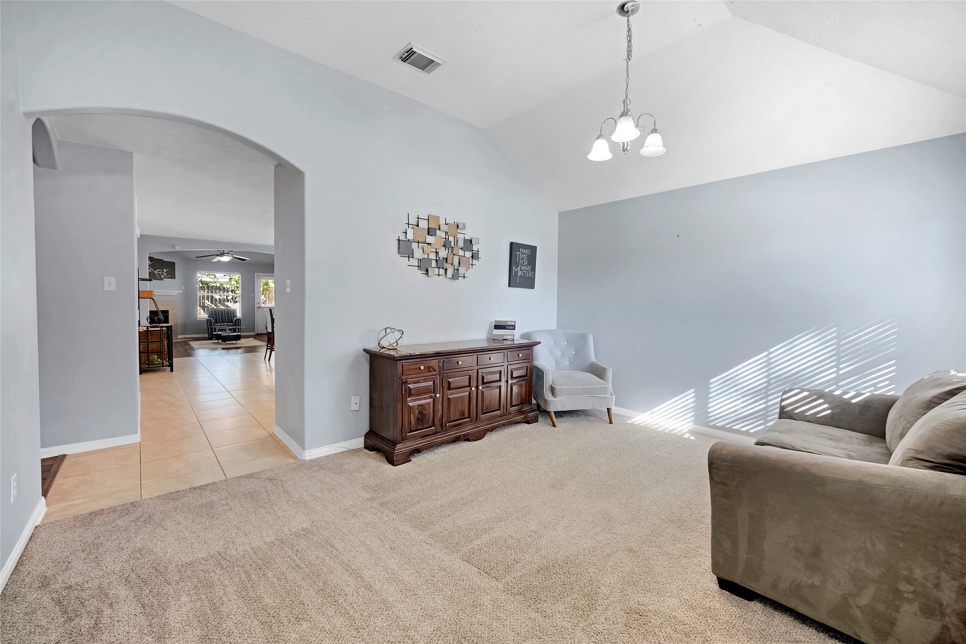 15835 Aldridge Creek Court, Cypress, TX 77429 Furnished front living area with vaulted ceilings, natural light, and comfortable seating.