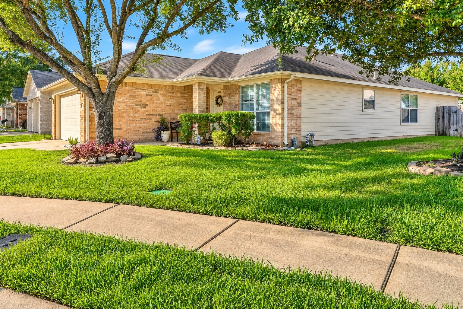 15835 Aldridge Creek Court, Cypress, TX 77429 Attractive single-story home with brick and siding exterior, mature trees, and a well-maintained front yard.