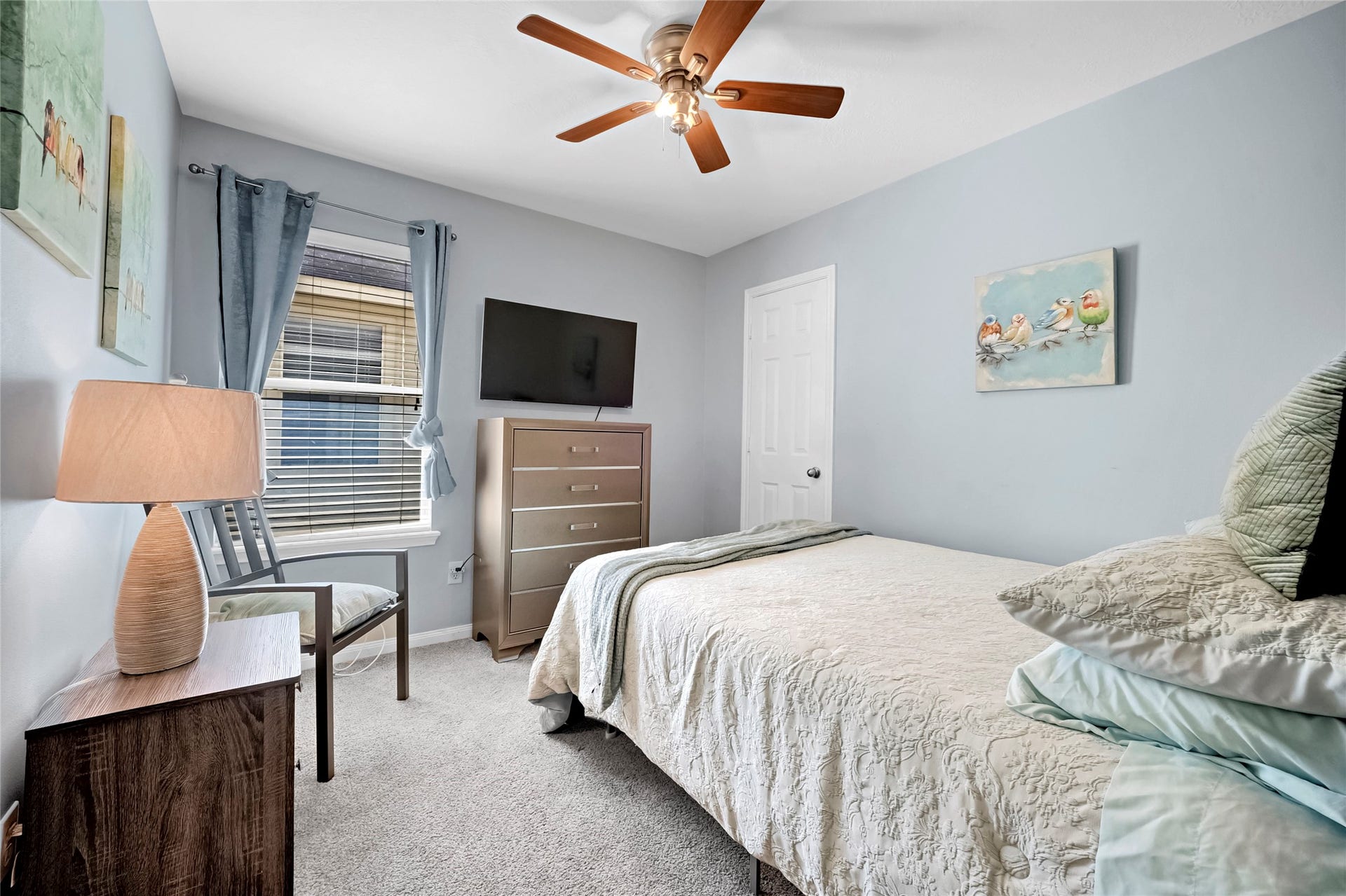 15835 Aldridge Creek Court, Cypress, TX 77429 Comfortable furnished bedroom with ceiling fan, television, and natural light.