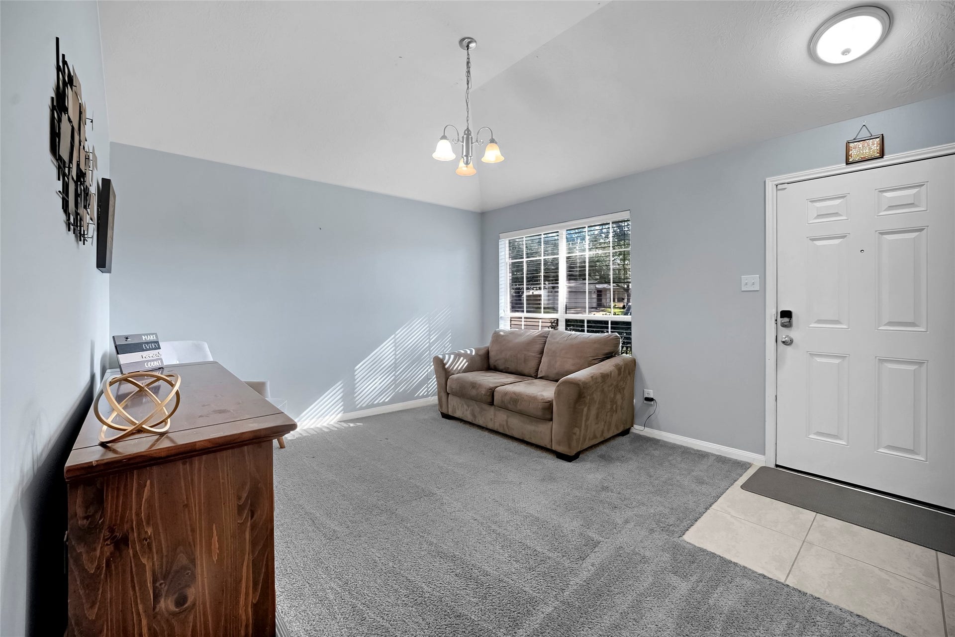 15835 Aldridge Creek Court, Cypress, TX 77429 Welcoming furnished sitting area with large windows and neutral finishes.