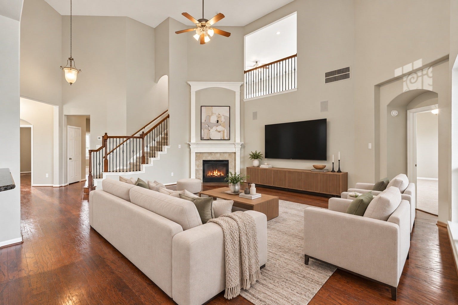 14226 Marin Drive, Cypress, TX 77429 Virtually Staged: A central hearth serves as the rooms focal point, complemented by an open balcony look-through, wide walkways, and generous floor space ideal for versatile furniture arrangements.