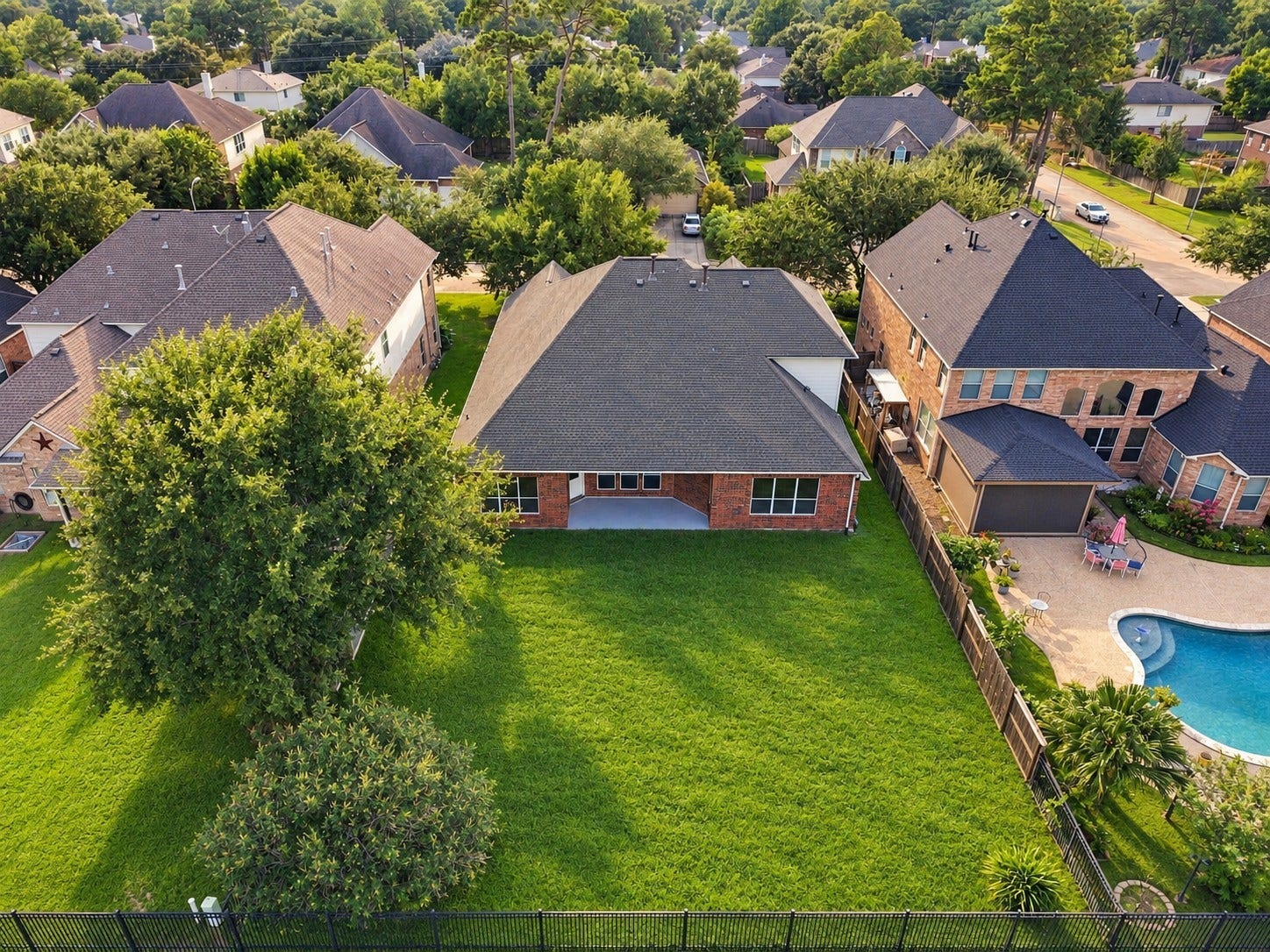 14226 Marin Drive, Cypress, TX 77429 This drone perspective emphasizes the property's prime lot layout. The deep back lawn provides an incredible canvas for outdoor living.