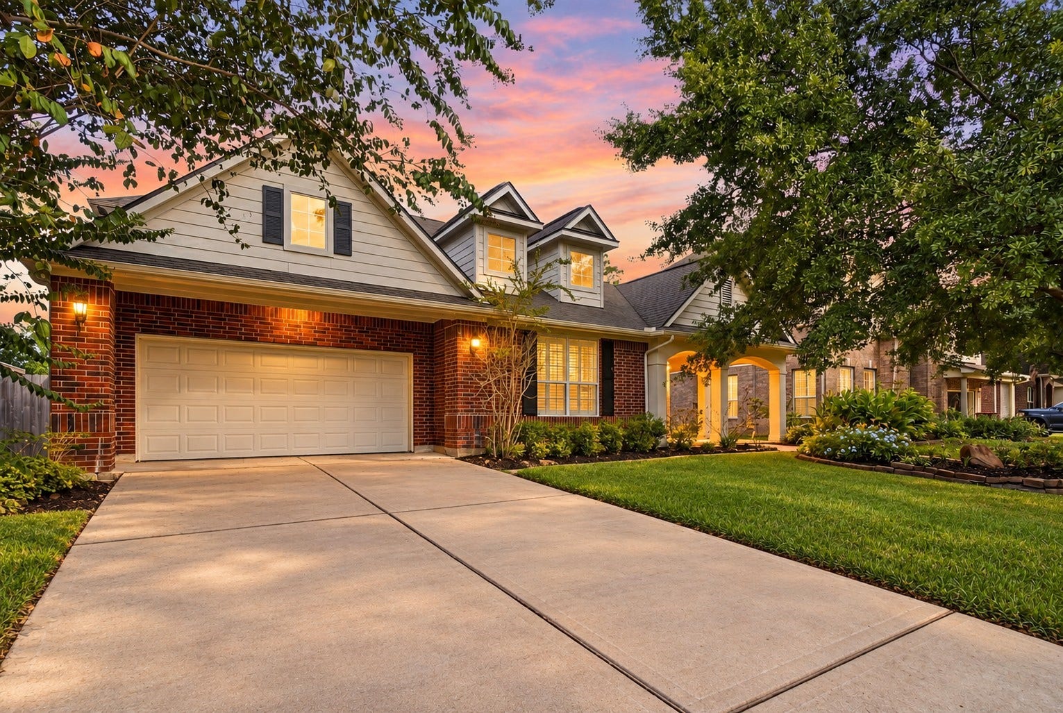 14226 Marin Drive, Cypress, TX 77429 Crafted with timeless appeal, this inviting property welcomes you with rich brick detailing, decorative shutters, and a beautifully lit facade.