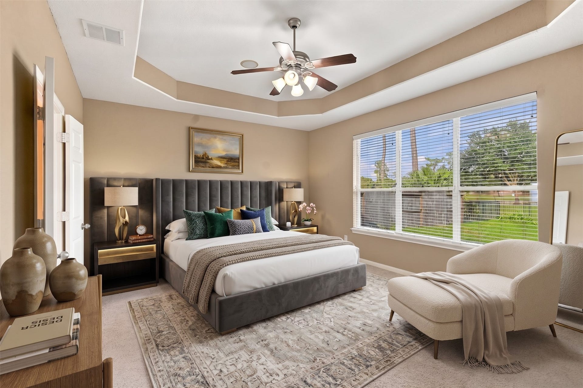 14226 Marin Drive, Cypress, TX 77429 Virtually Staged: This spacious primary suite features a tray ceiling detailed with crown molding and a central light fixture with a ceiling fan. A expansive wall of windows brings in natural light and views of the backyard.