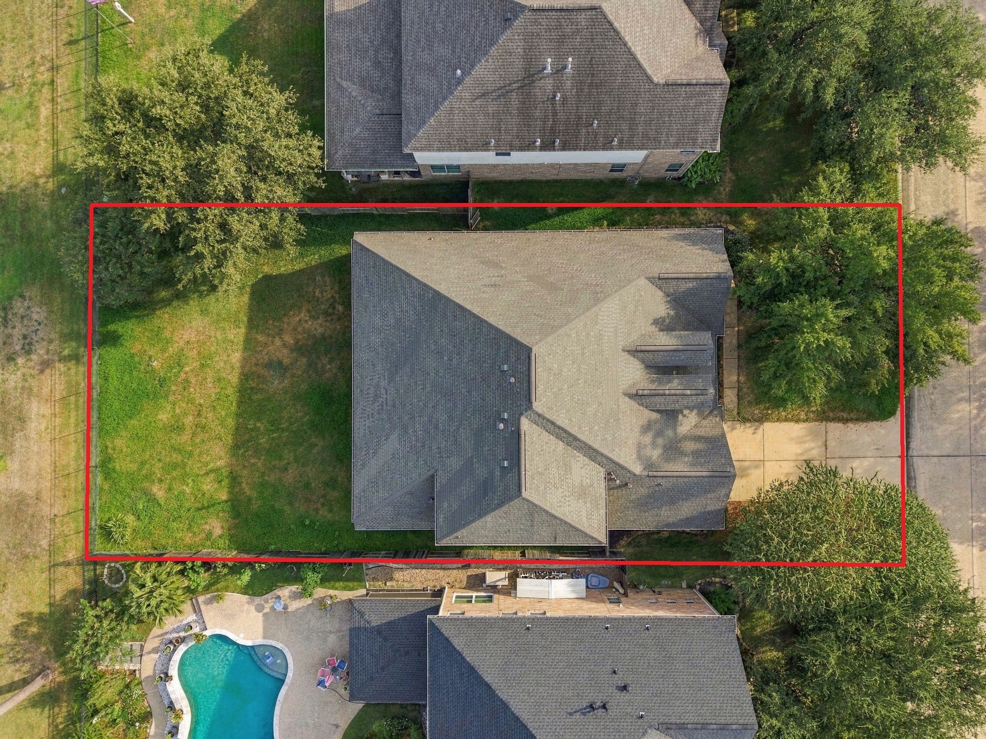 14226 Marin Drive, Cypress, TX 77429 Demonstrating the full layout from above, this shot showcases the home's substantial footprint, multi-gable roof design, and private perimeter boundaries.