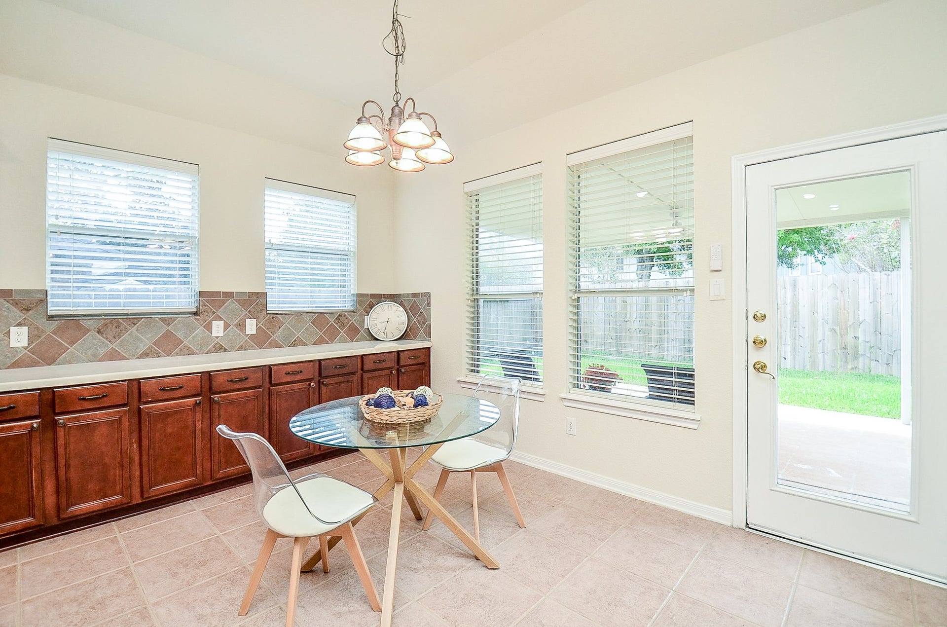 14407 Spanish River Lane, Cypress, TX 77429 Start the morning with plenty of natural light and a view of the backyard. The breakfast area sits beside the kitchen with direct access outside, making the transition from indoor meals to the patio effortless.