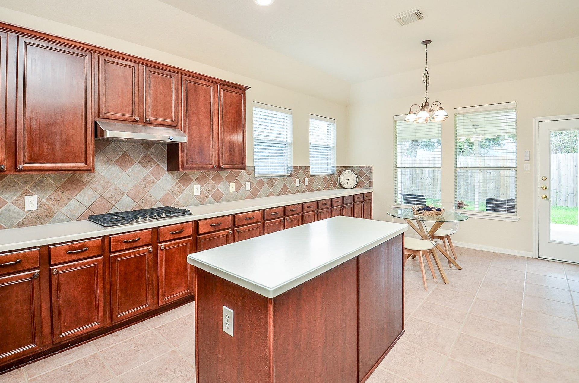 14407 Spanish River Lane, Cypress, TX 77429 If kitchen storage is high on the wish list, this one delivers. An impressive run of cabinetry, generous prep space and a center island provide plenty of room for cooking, serving and keeping everything organized.