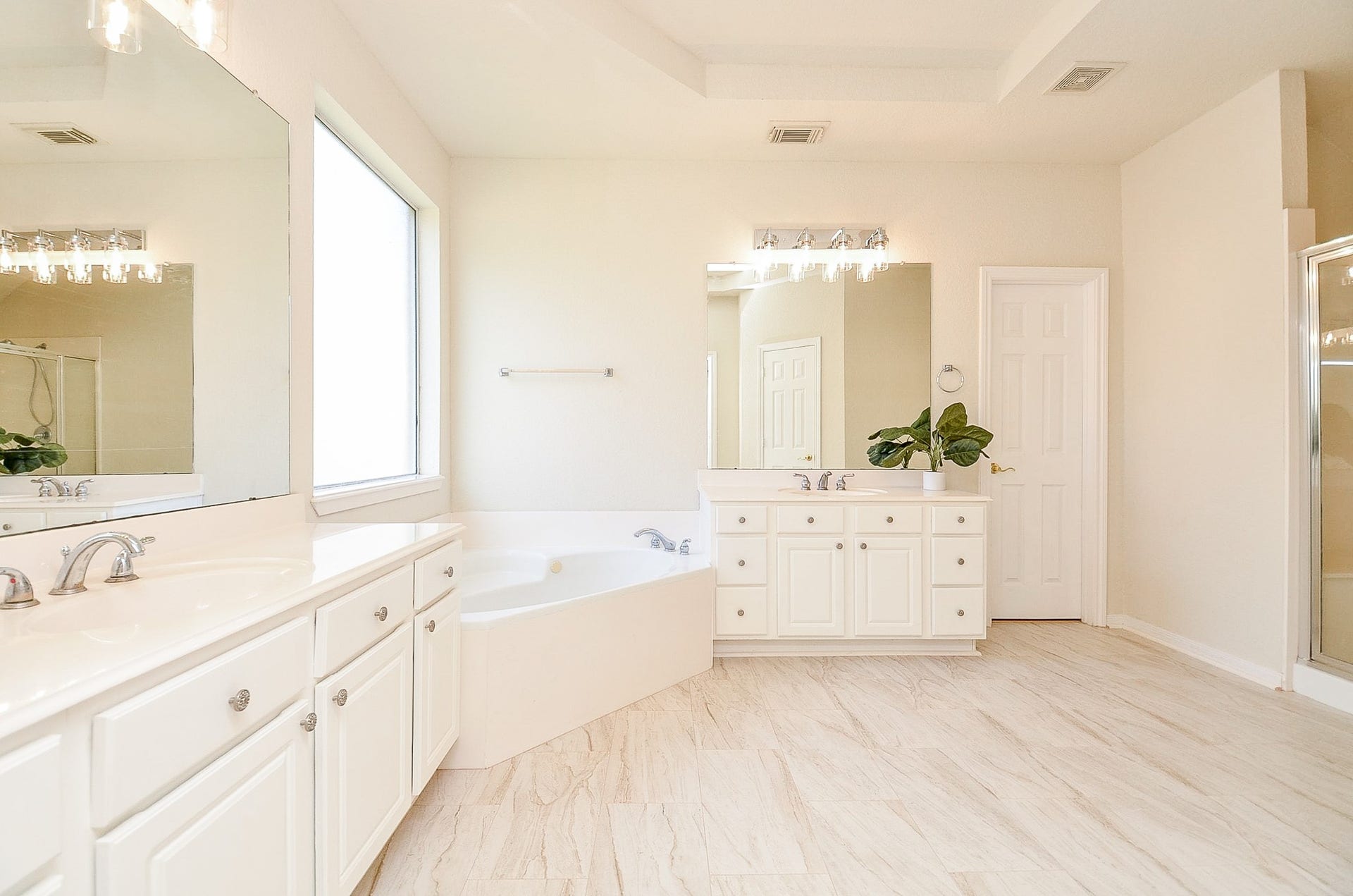 14407 Spanish River Lane, Cypress, TX 77429 Two vanities mean two dedicated spaces, while the soaking tub and separate shower complete a primary bath that offers both function and room to move.