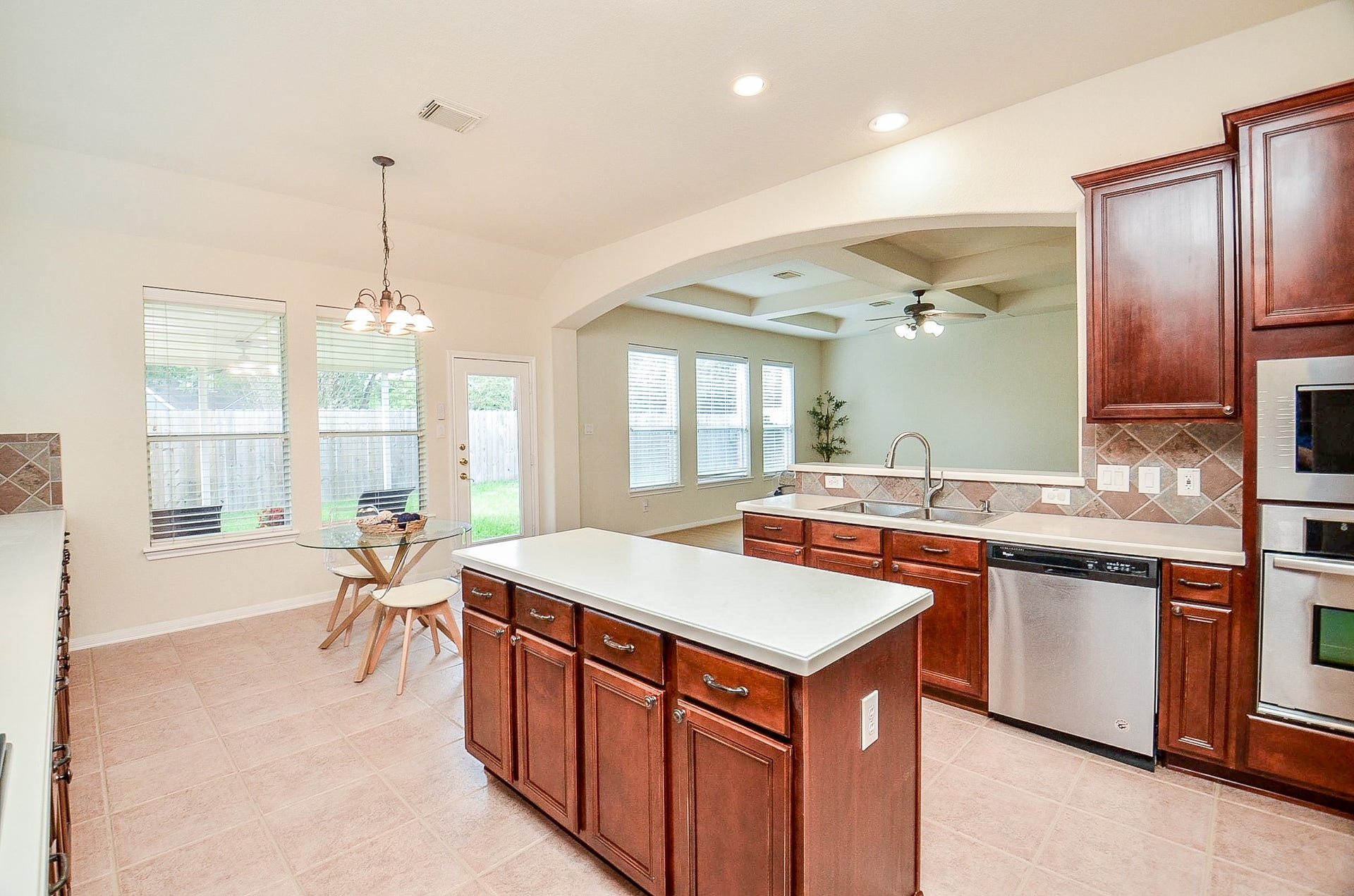 14407 Spanish River Lane, Cypress, TX 77429 The open floor plan keeps the kitchen connected to the family room, while the island provides additional workspace and storage.