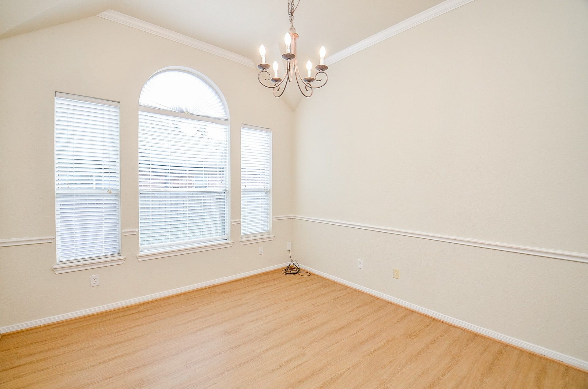 14407 Spanish River Lane, Cypress, TX 77429 The vaulted ceiling, oversized windows and architectural detailing give the dining room plenty of presence without feeling closed off from the rest of the home.