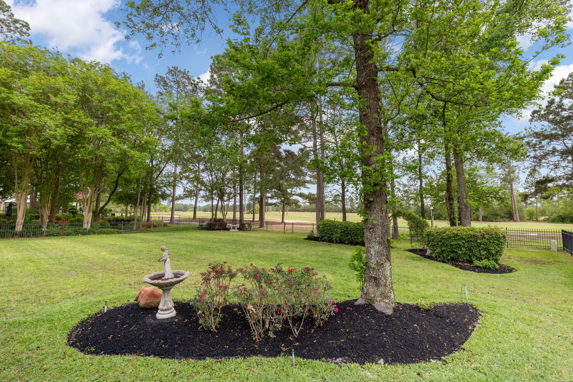 6207 Windrose Hollow Lane, Spring, TX 77379 Mature trees and curated landscaping frame the backyard, adding beauty and shade to the outdoor experience. The large lot creates room for play, entertaining, and peaceful evenings outside.