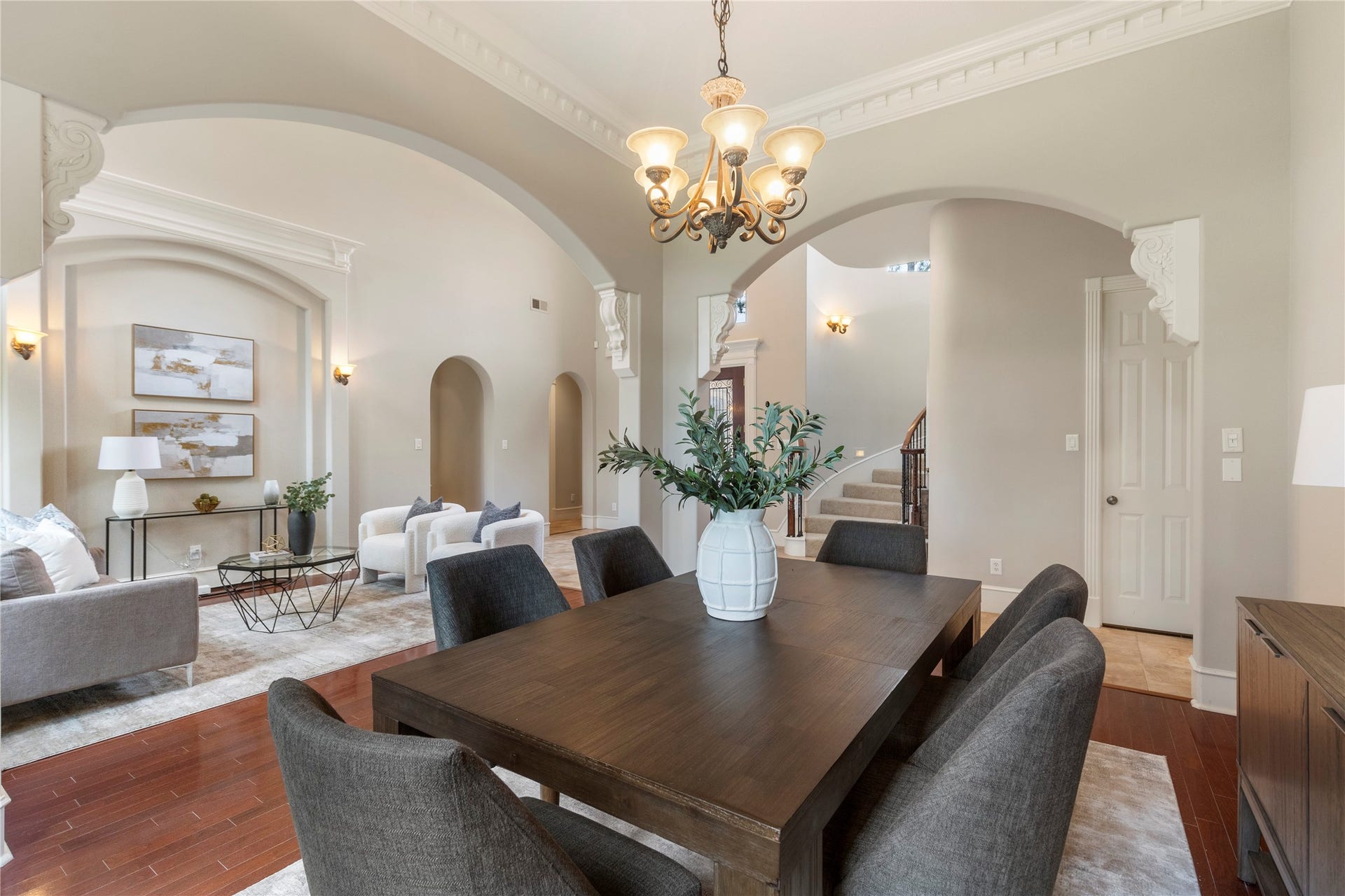 6207 Windrose Hollow Lane, Spring, TX 77379 Graceful arches lead from the dining area toward the main living spaces, reinforcing the homes custom flow. The layout balances formal entertaining with comfortable everyday living.