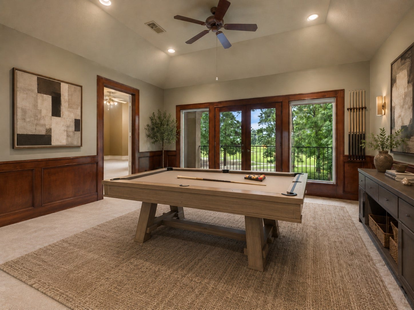 6207 Windrose Hollow Lane, Spring, TX 77379 Upstairs, the game room opens to a balcony and offers a flexible setting for recreation, homework, or casual gathering. The rooms size and placement create a separate destination away from the main living areas. (Digitally Staged)