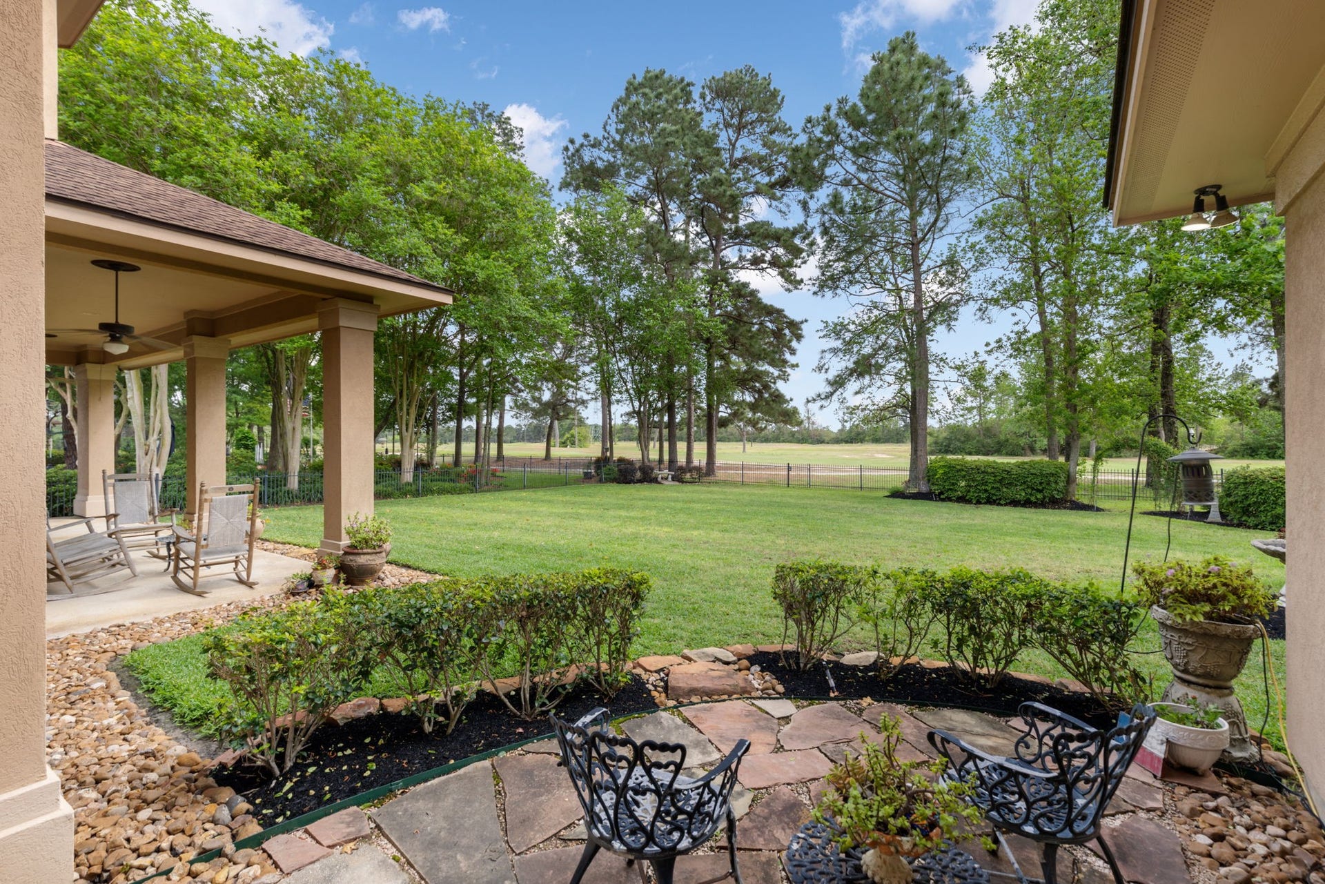 6207 Windrose Hollow Lane, Spring, TX 77379 The flagstone corner patio creates another outdoor destination beyond the covered porch. It is a charming place to enjoy the fairway views and tree lined surroundings.