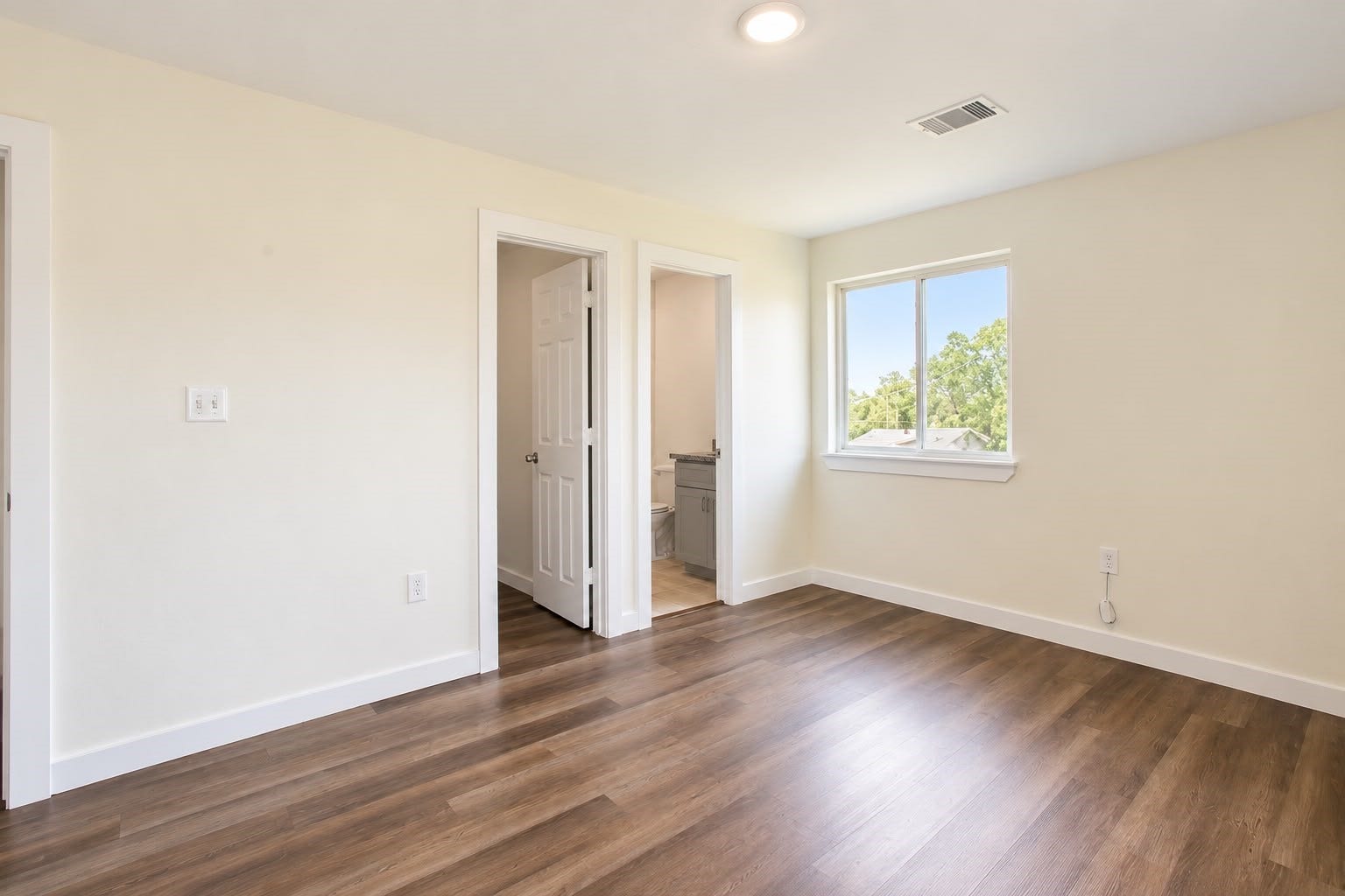 8204 Eastover Street, #A, Houston, TX 77028 Spacious bedroom with natural light and wood style floors.