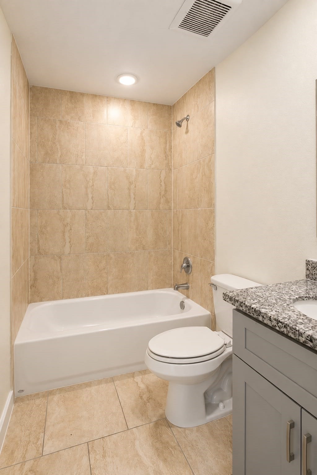 8204 Eastover Street, #A, Houston, TX 77028 Full bathroom with tiled tub and shower combo and vanity storage.