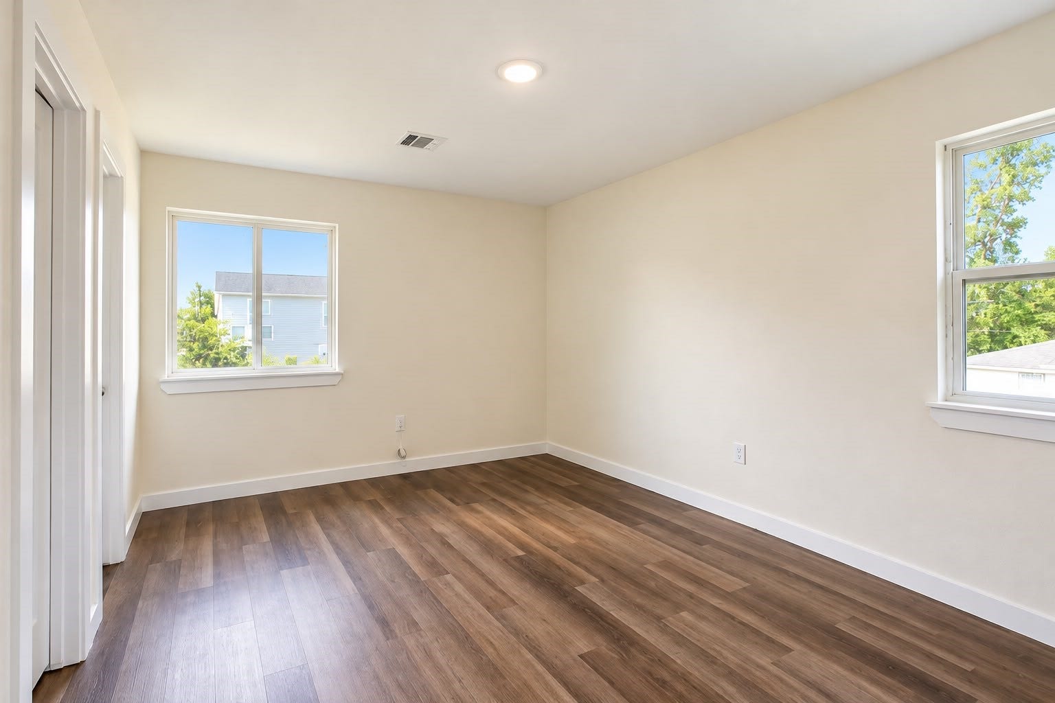 8204 Eastover Street, #A, Houston, TX 77028 Bright bedroom with two windows and recessed lighting.