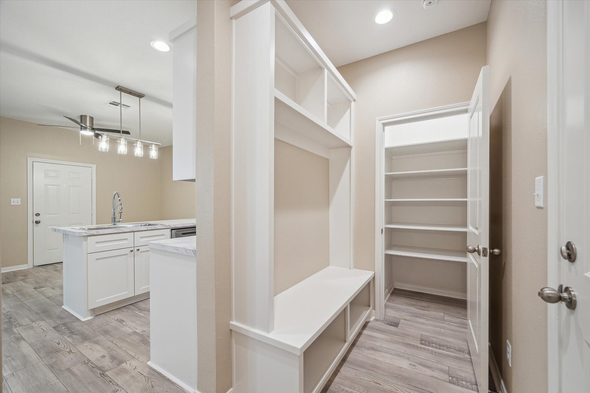 As you enter from the garage is storage and pantry