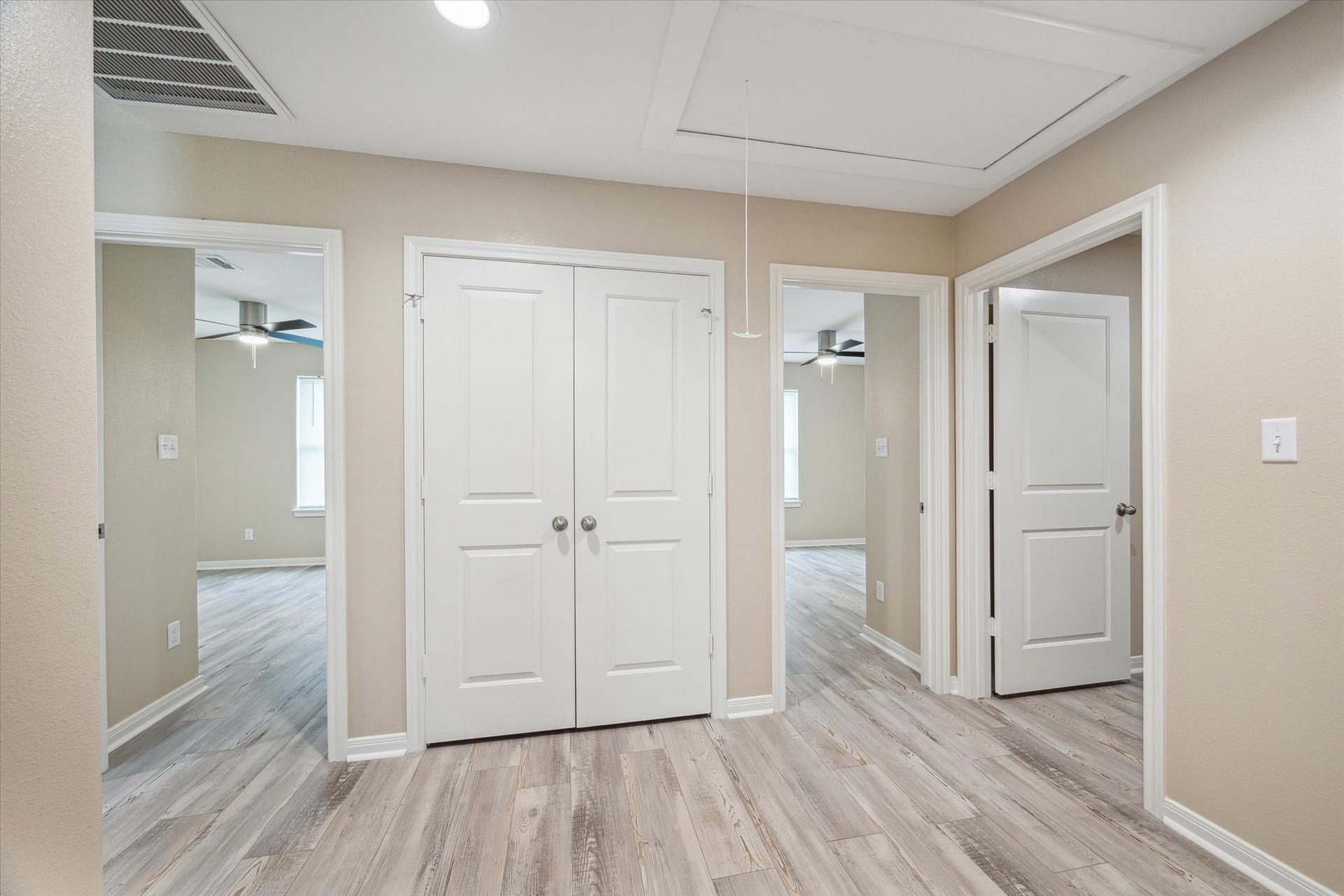 From outside the Primary you see the two other bed rooms.  To the right is the Utility Room which will fit 2 full
size, washer and dryer.