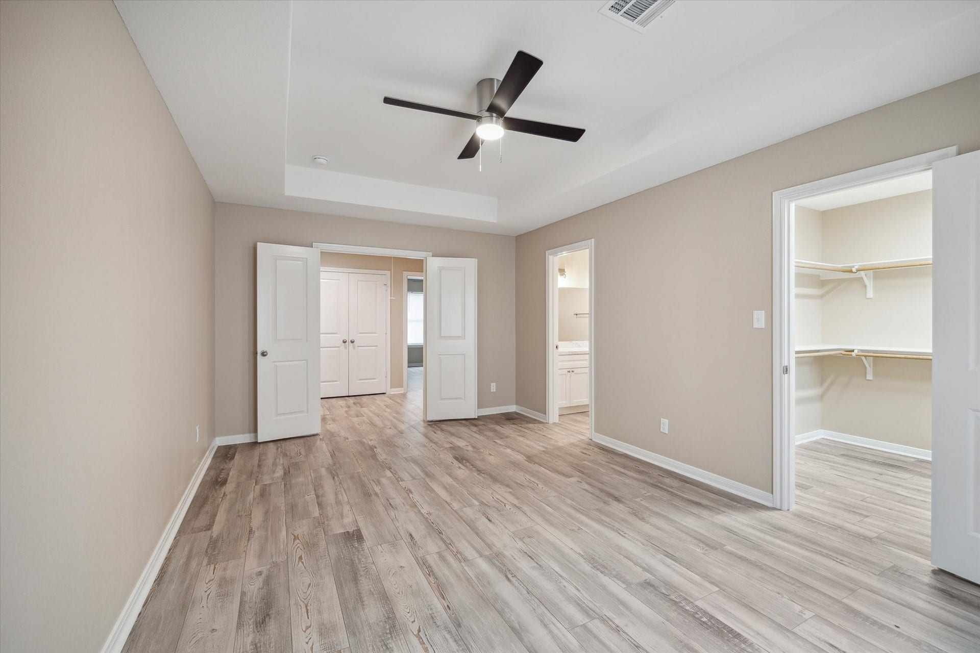 Primary on second floor with walk-in closet and ensuite bath.  Large glass shower and double sinks.