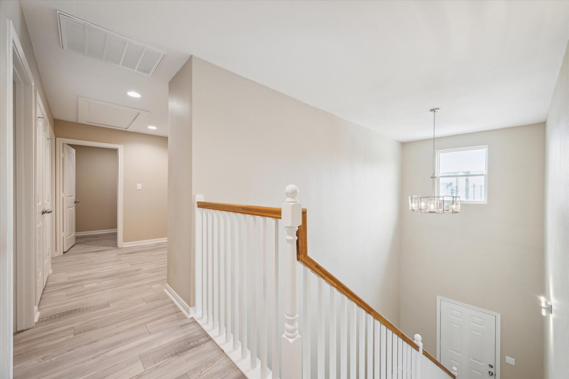 Looking down the hall up stairs to the utility room