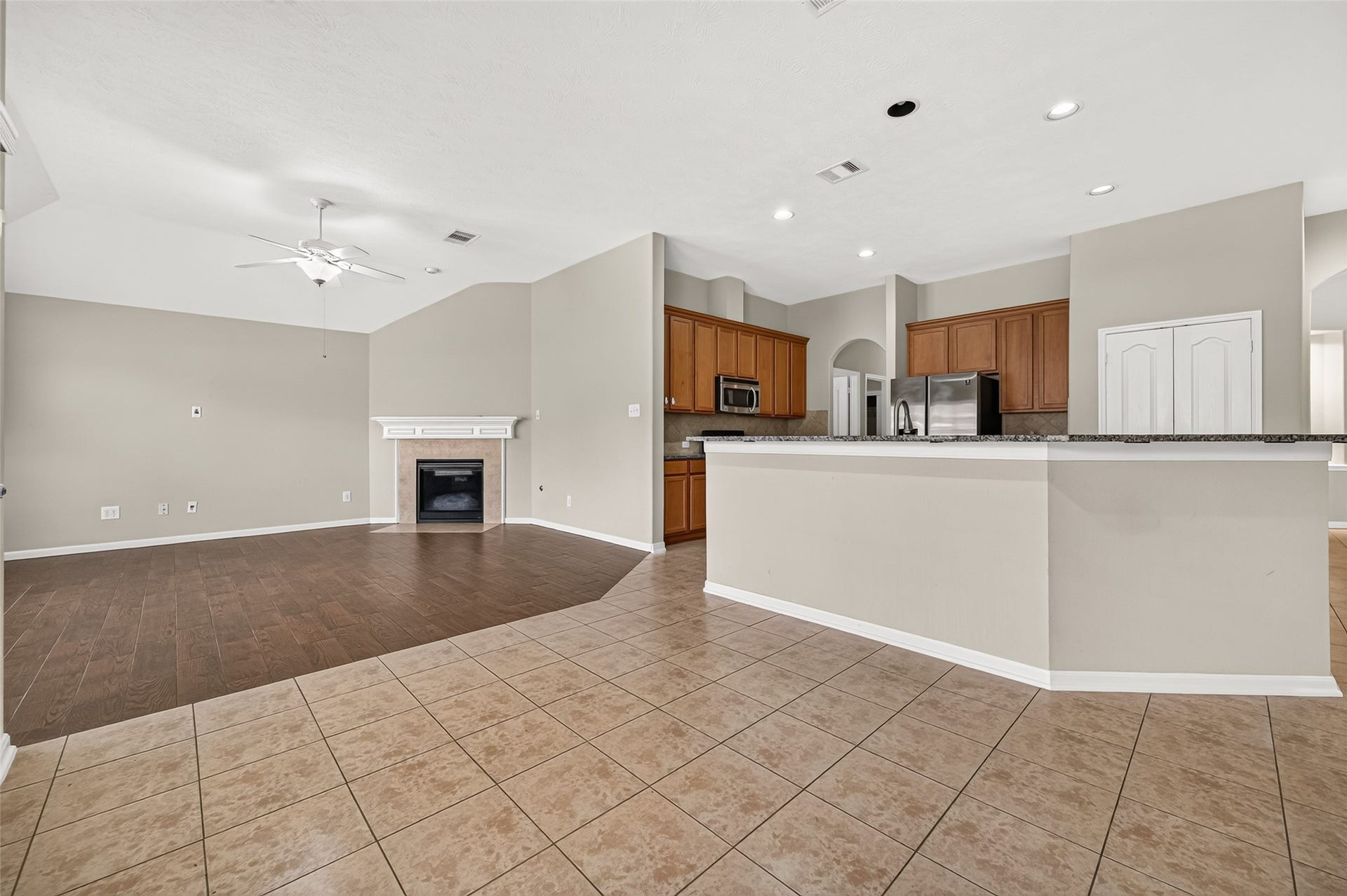 9307 Russeff Field Lane, Rosenberg, TX 77469 Spacious breakfast area showcasing tile flooring, recessed lighting, and a seamless connection to the kitchen and living room.