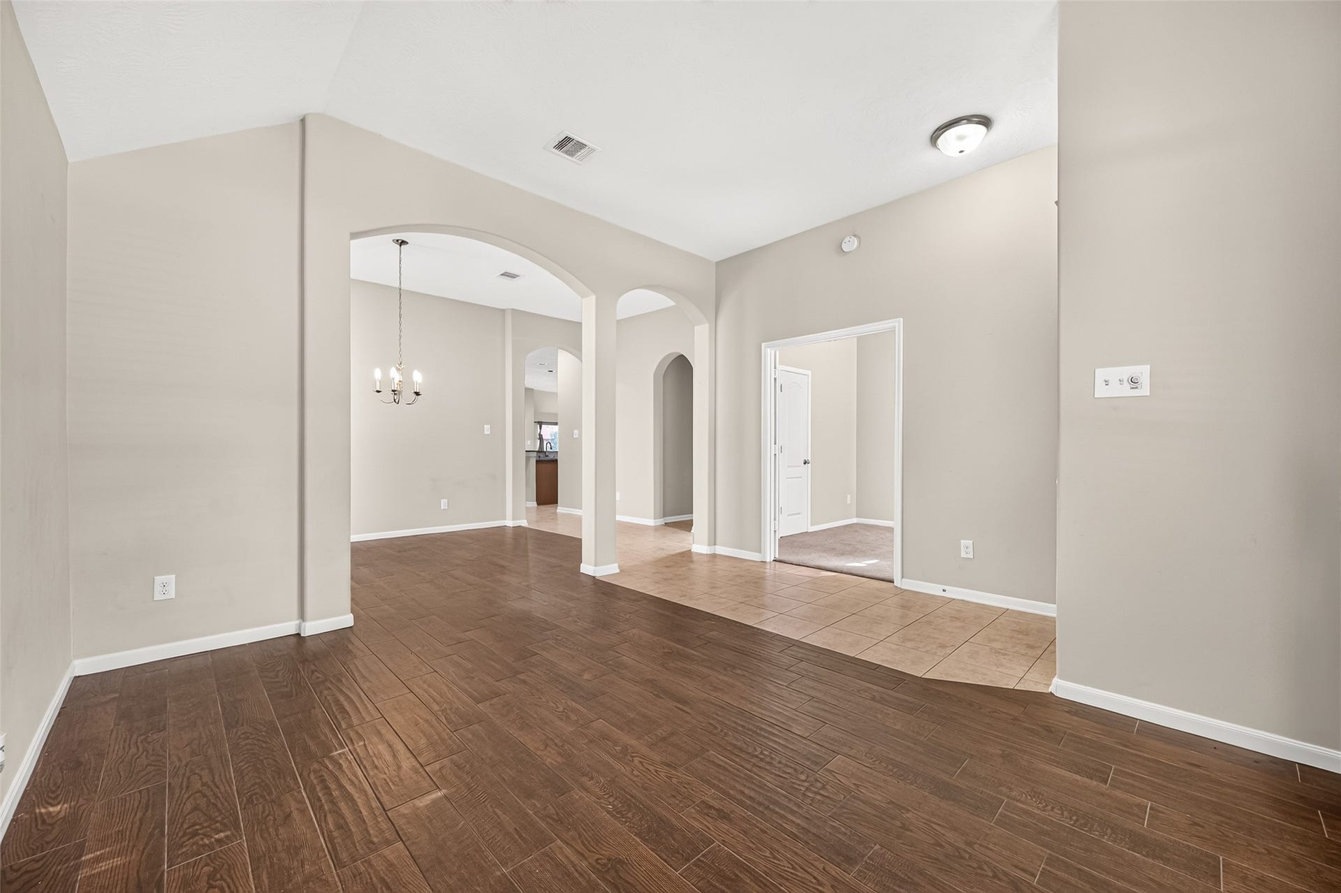 9307 Russeff Field Lane, Rosenberg, TX 77469 Another view of the flex area showcasing its open layout, natural light, and connection to the entryway.
