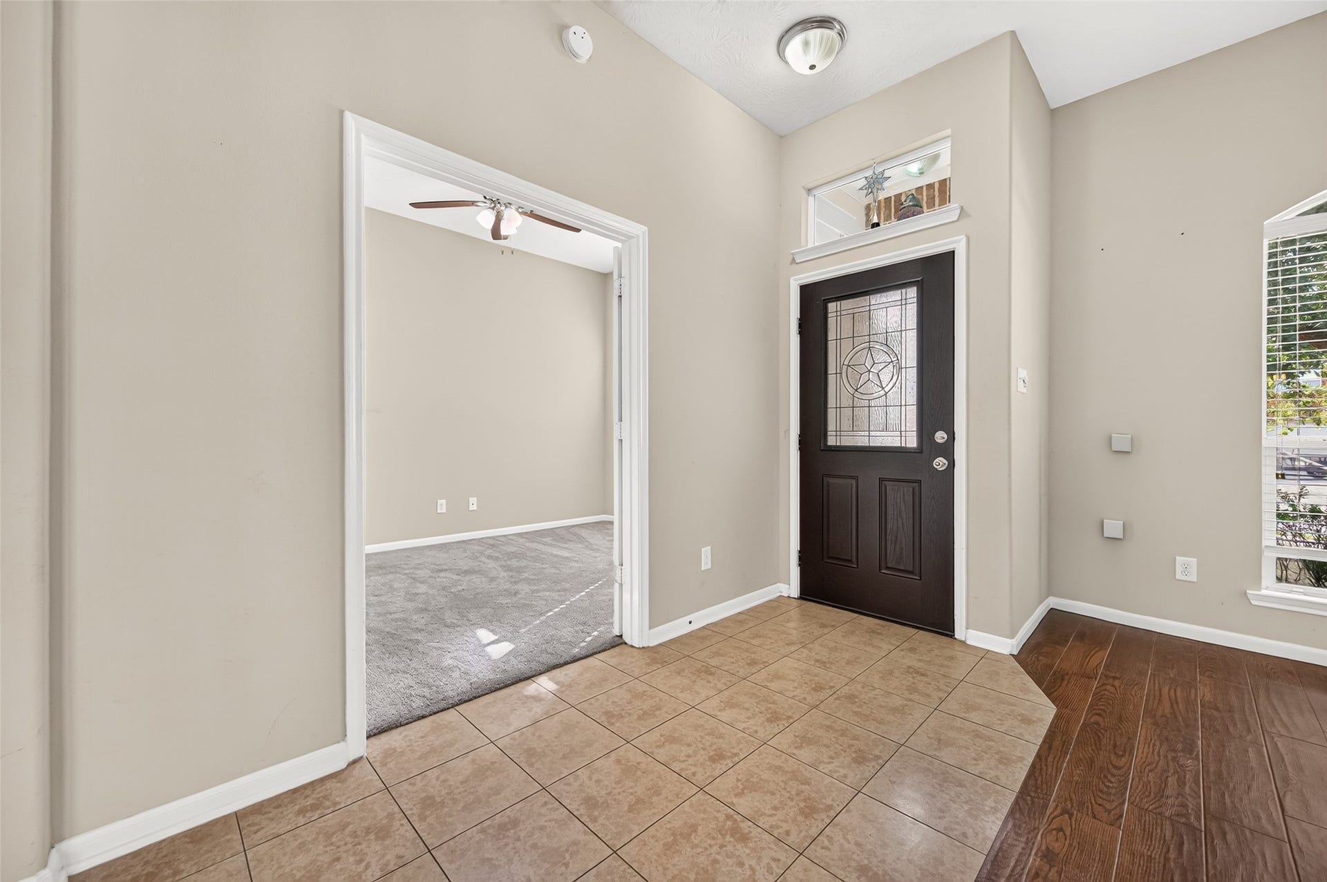 9307 Russeff Field Lane, Rosenberg, TX 77469 Additional view of the entryway highlighting the decorative arches, natural light, and open layout.