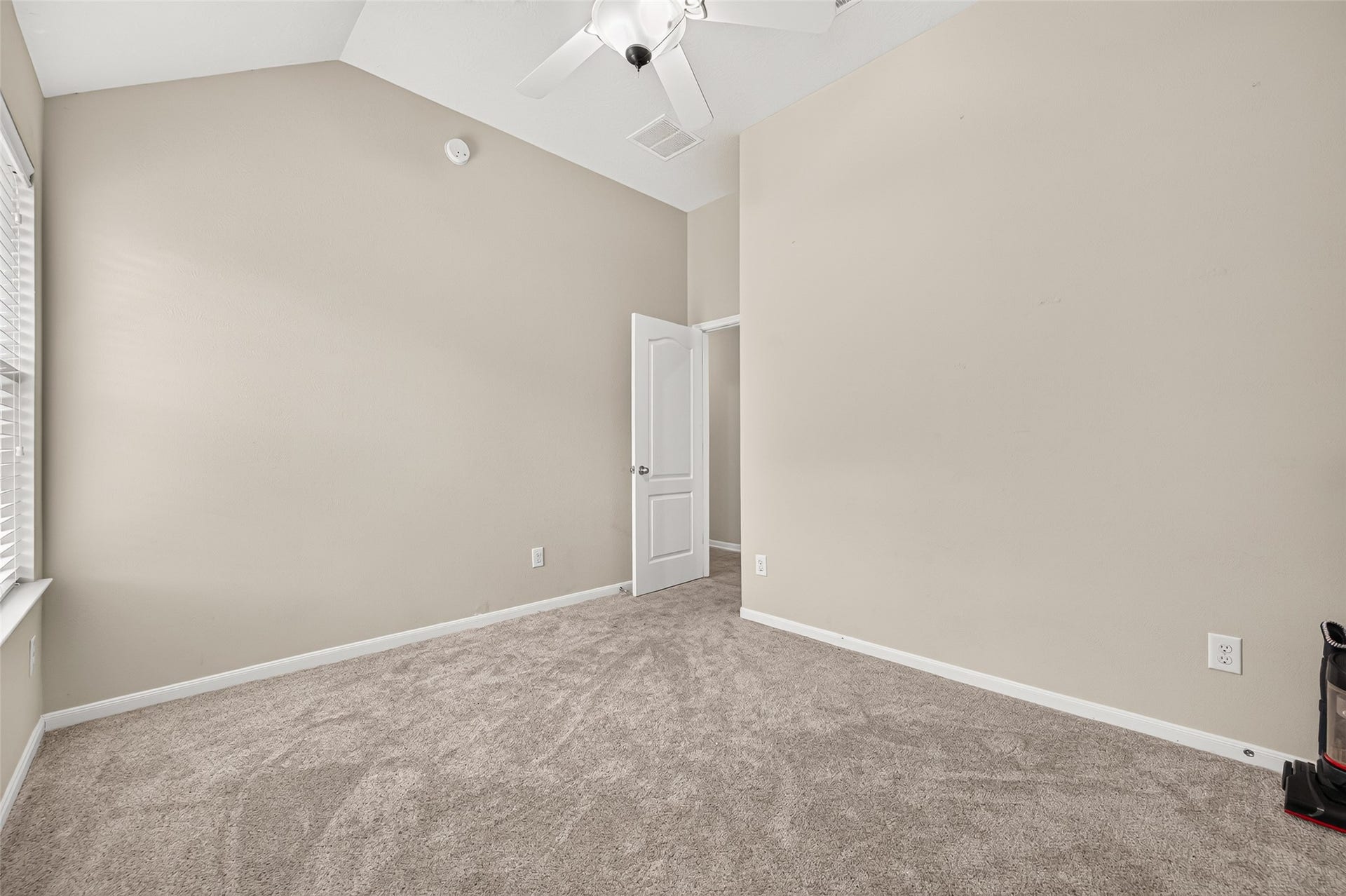 9307 Russeff Field Lane, Rosenberg, TX 77469 Additional secondary bedroom view showcasing the ceiling fan, closet doors, and natural light.