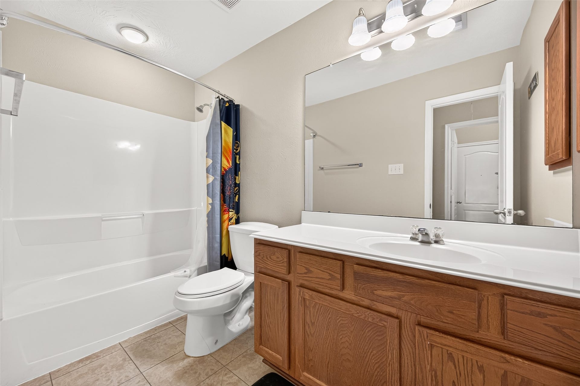 9307 Russeff Field Lane, Rosenberg, TX 77469 Secondary bathroom featuring a tub and shower combination, vanity, and neutral finishes.