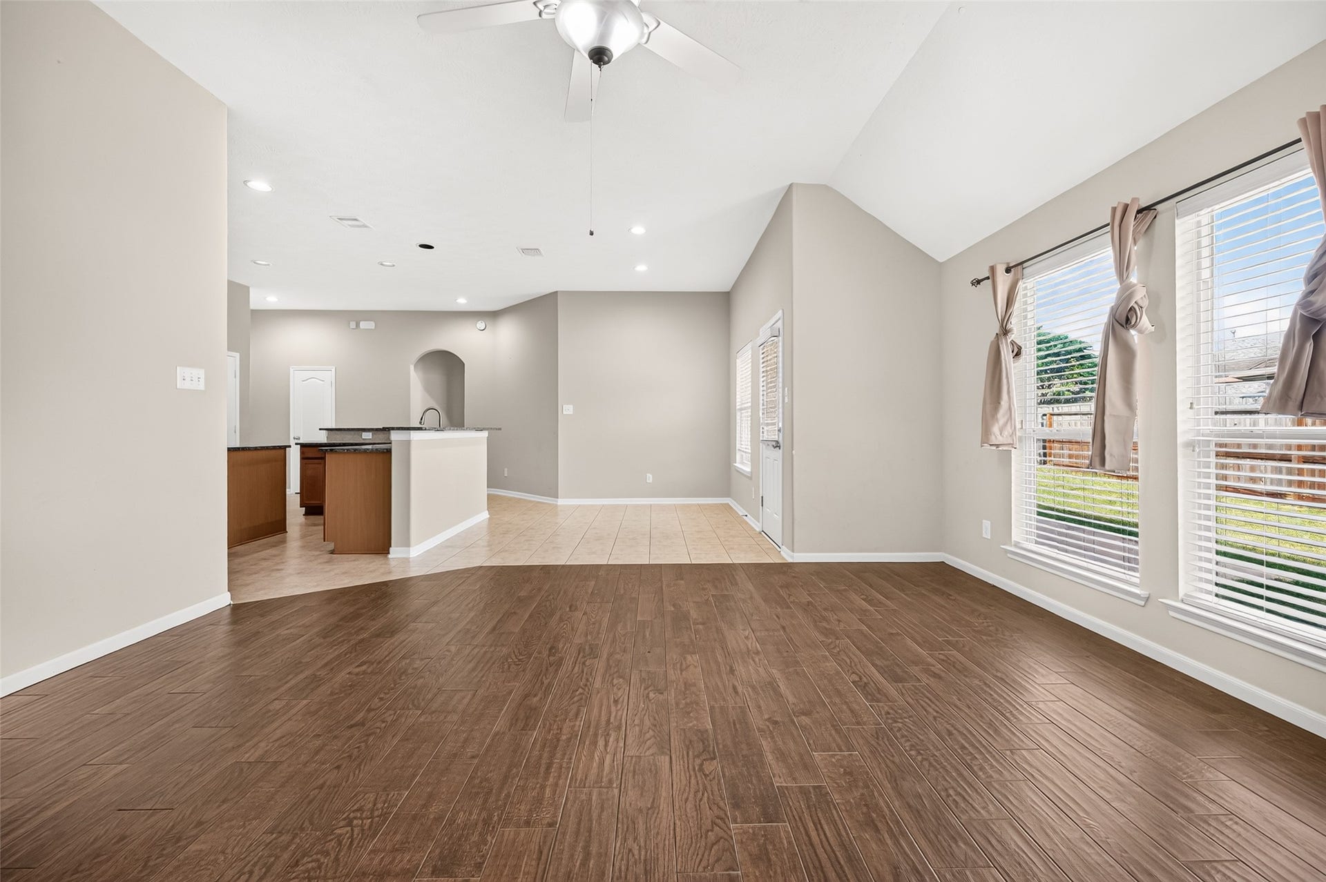 9307 Russeff Field Lane, Rosenberg, TX 77469 Another view of the living area highlighting its generous floor space and open connection to the kitchen.
