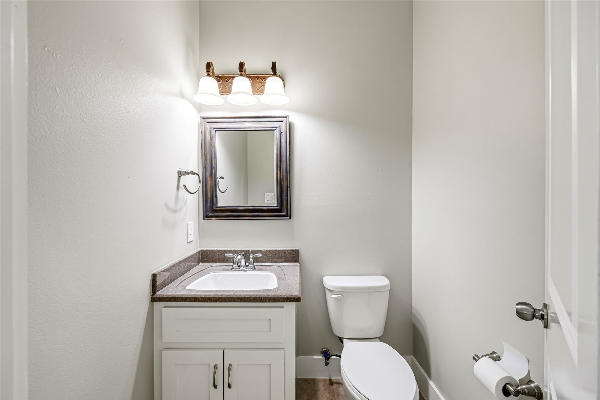 Half Bath off Kitchen Down the Hall