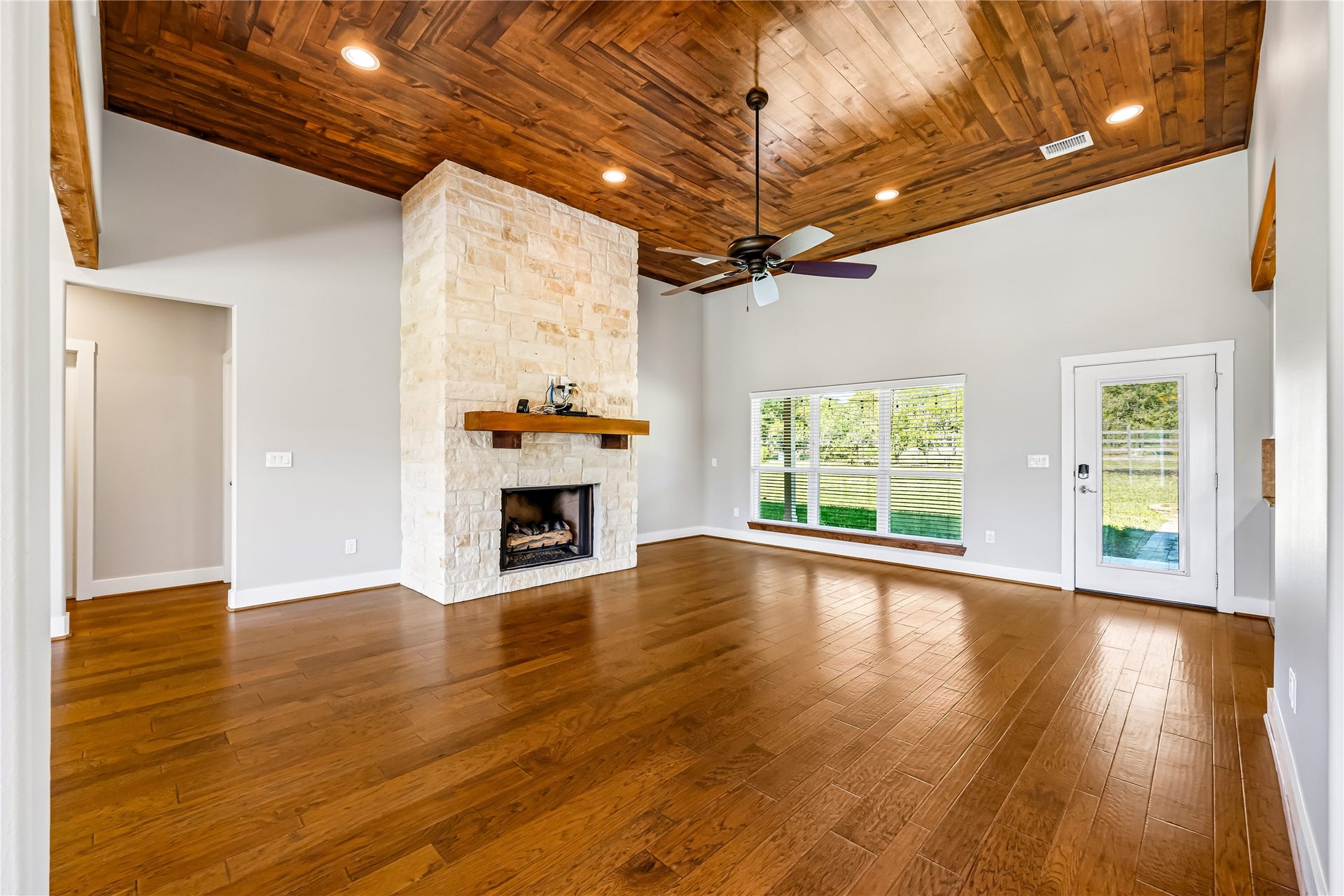 Fabulous Family Room w Rock Fireplace and Wood Accent Ceiling