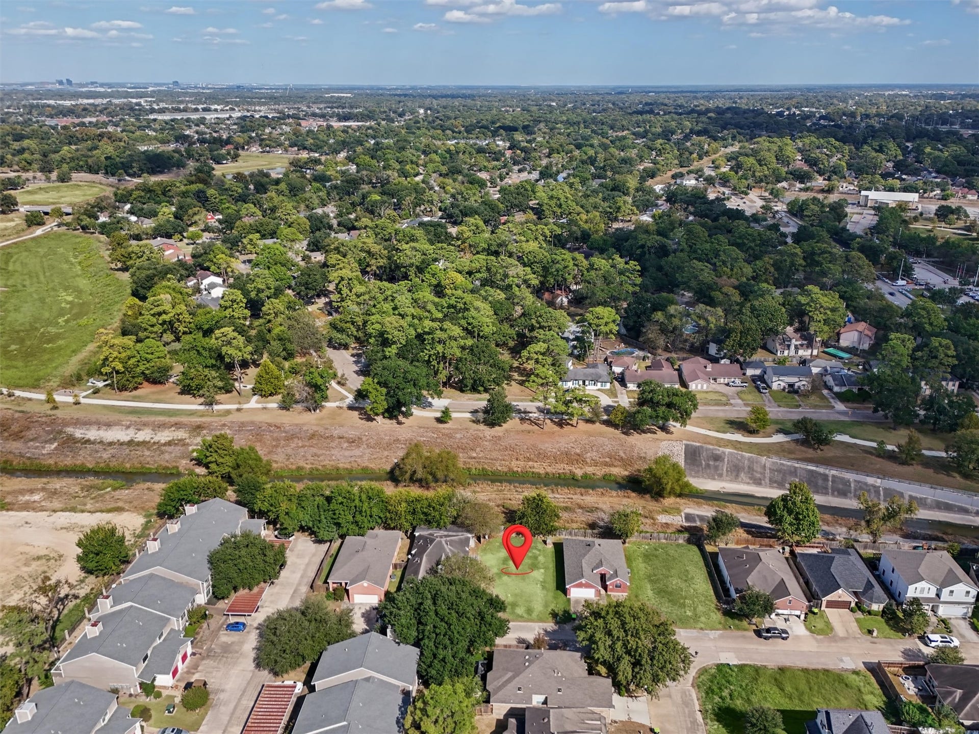 4444 Victory Dr, Houston, TX 77088 The red arrow highlights this cleared residential lot, offering a rare opportunity to enjoy added privacy with no immediate rear neighbors! Backing to an open greenbelt and waterway, this homesite provides a peaceful setting surrounded by mature trees and established homes.