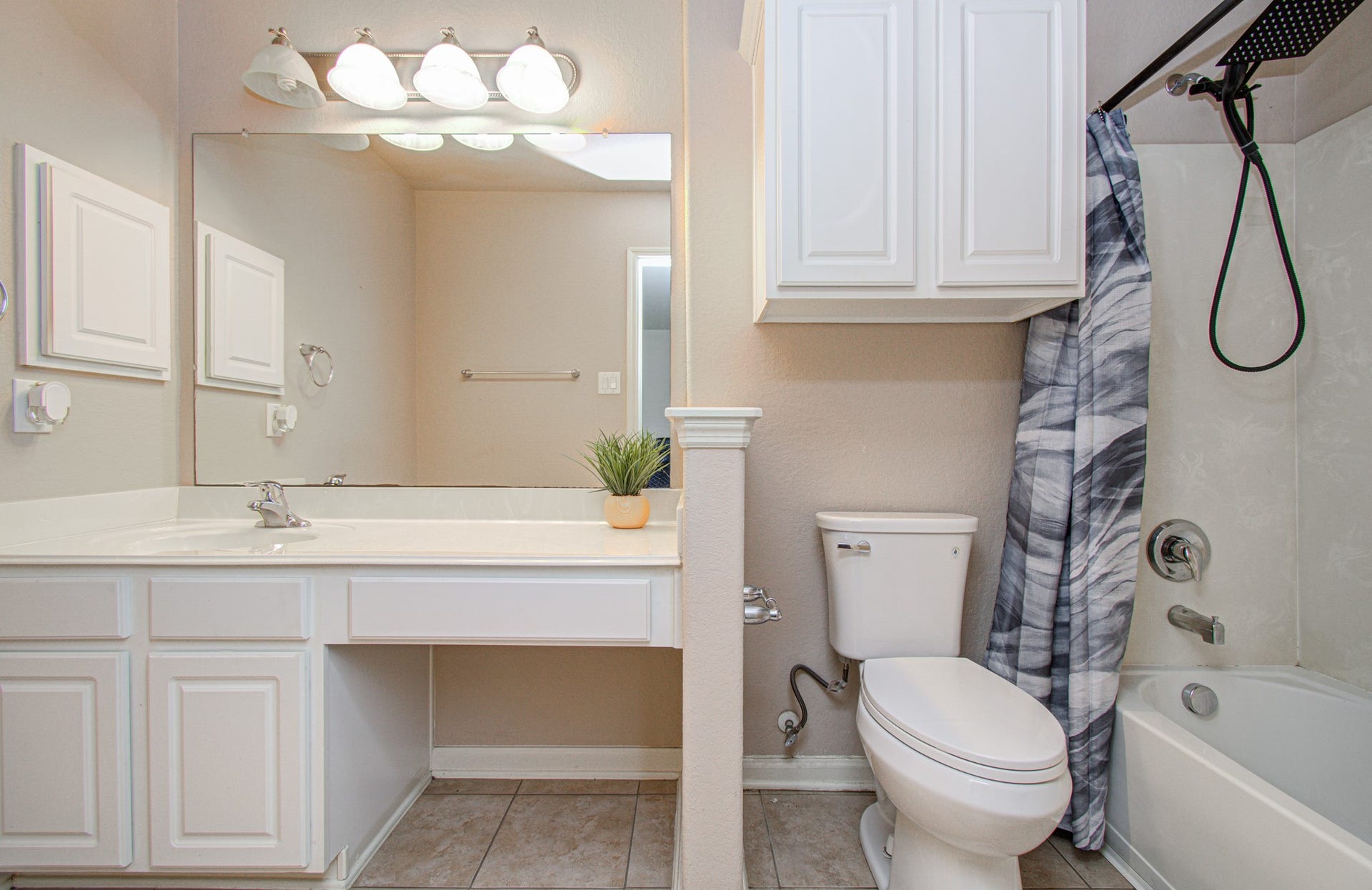 5935 Preserve Lane, Missouri City, TX 77459 Enjoy the convenience and privacy of an ensuite bathroom adjoining the upstairs secondary primary bedroom. This thoughtful feature creates a more independent living experience for household members or overnight guests, making the space especially appealing for multigenerational living or hosting visitors. Comfort, convenience, and flexibility come together in this valuable addition to the home's layout.