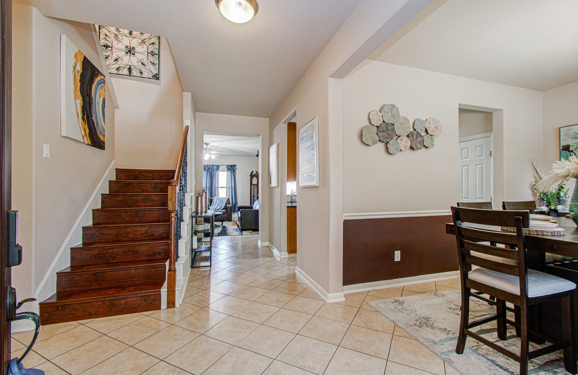 5935 Preserve Lane, Missouri City, TX 77459 Step inside to an inviting entryway that opens to a welcoming view of the staircase, formal dining room, and main living area. This thoughtfully arranged entrance creates an appealing first impression while offering a natural flow into the home's gathering spaces. Whether welcoming guests for a special occasion or enjoying everyday moments, this entryway sets the stage for comfortable living and memorable gatherings.
